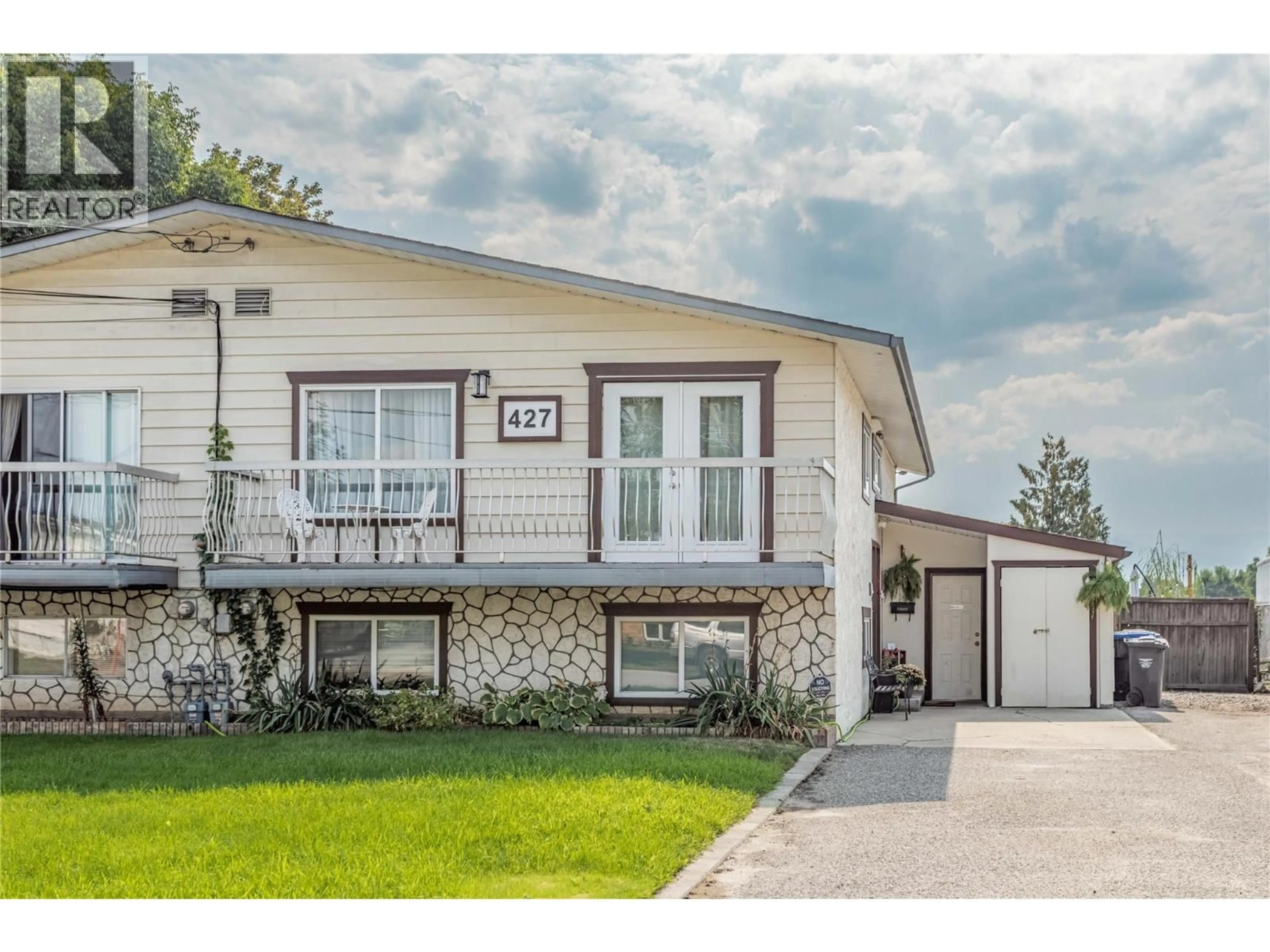 Home with vinyl exterior material, street for 427 KILLARNEY ROAD, Kelowna British Columbia V1X5C6