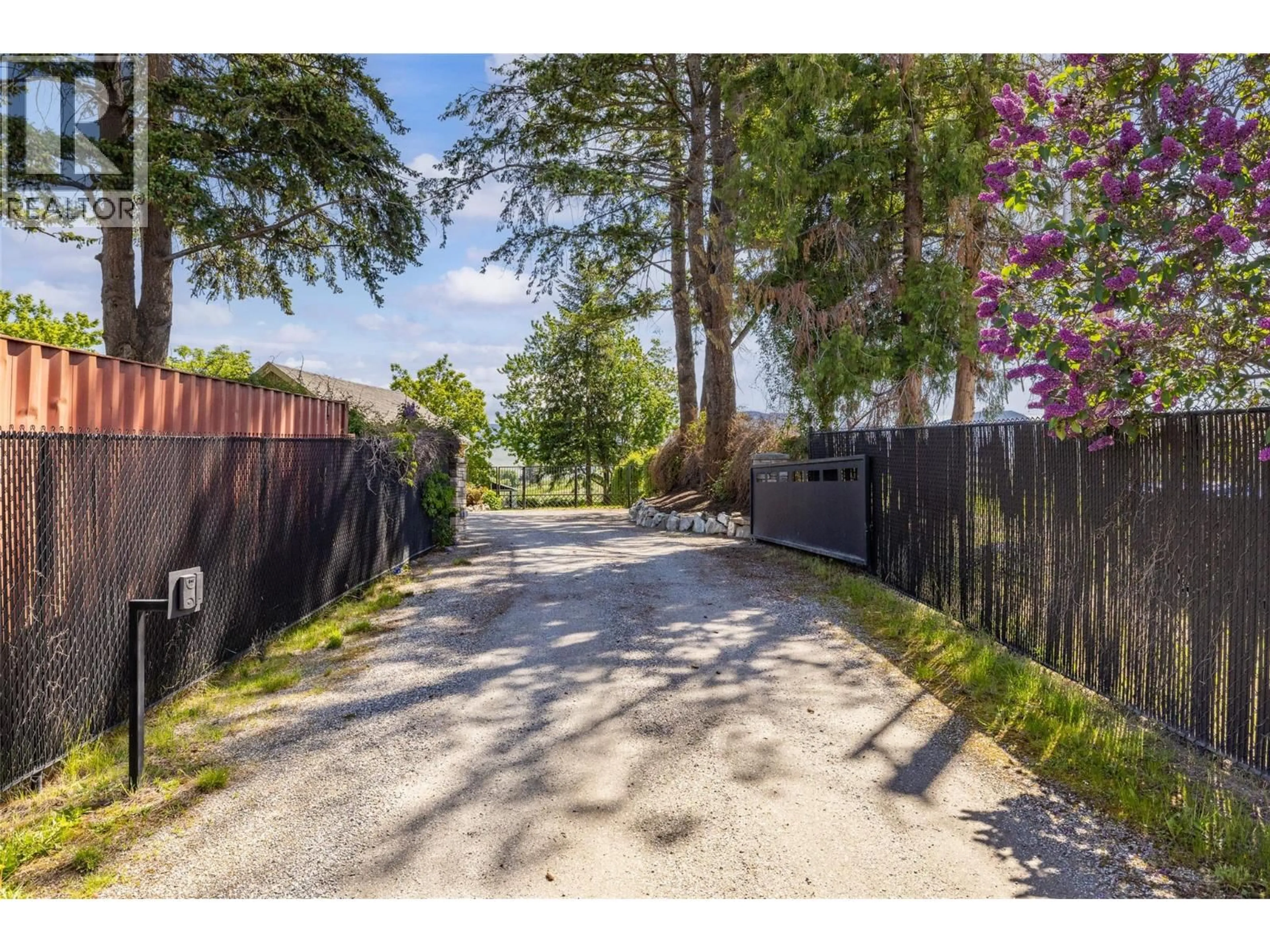 A pic from outside/outdoor area/front of a property/back of a property/a pic from drone, street for 2430 LONGHILL ROAD, Kelowna British Columbia V1V2G3