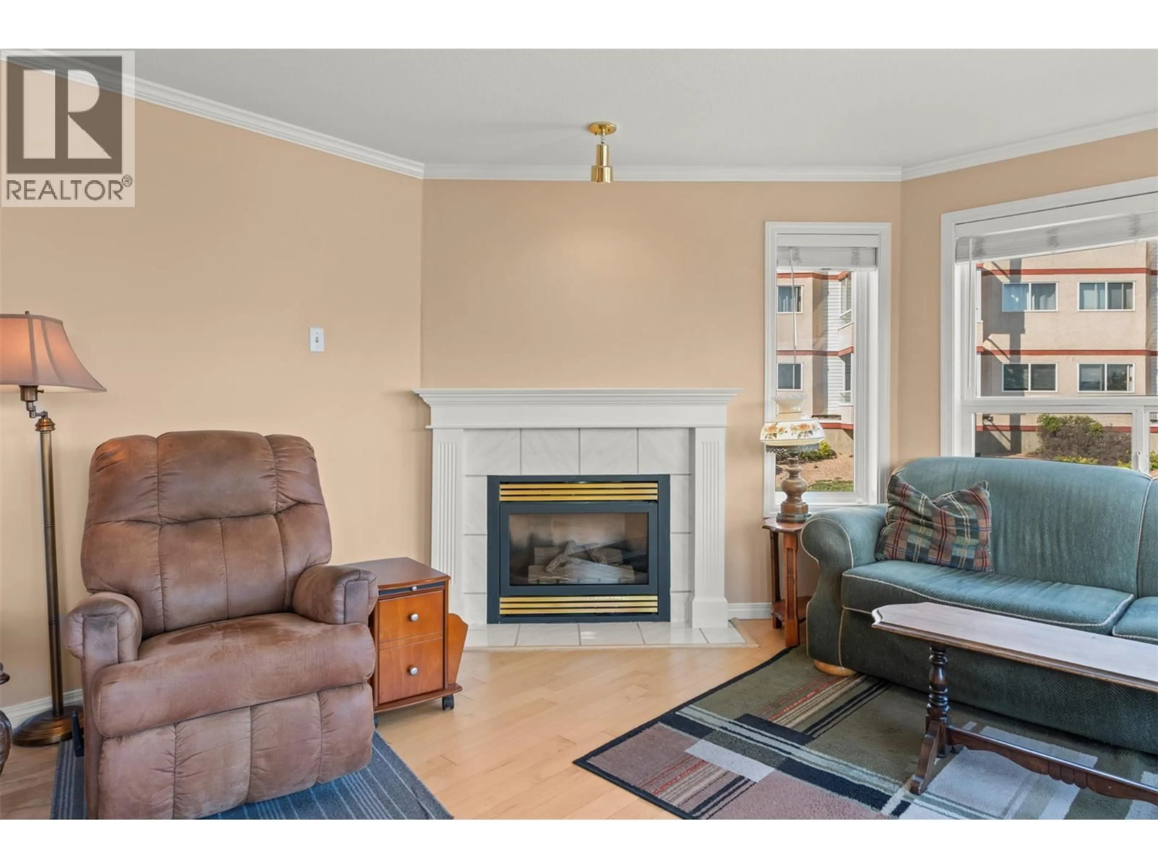 Living room with furniture, wood/laminate floor for 202 - 3806 35 AVENUE, Vernon British Columbia V1T9N6