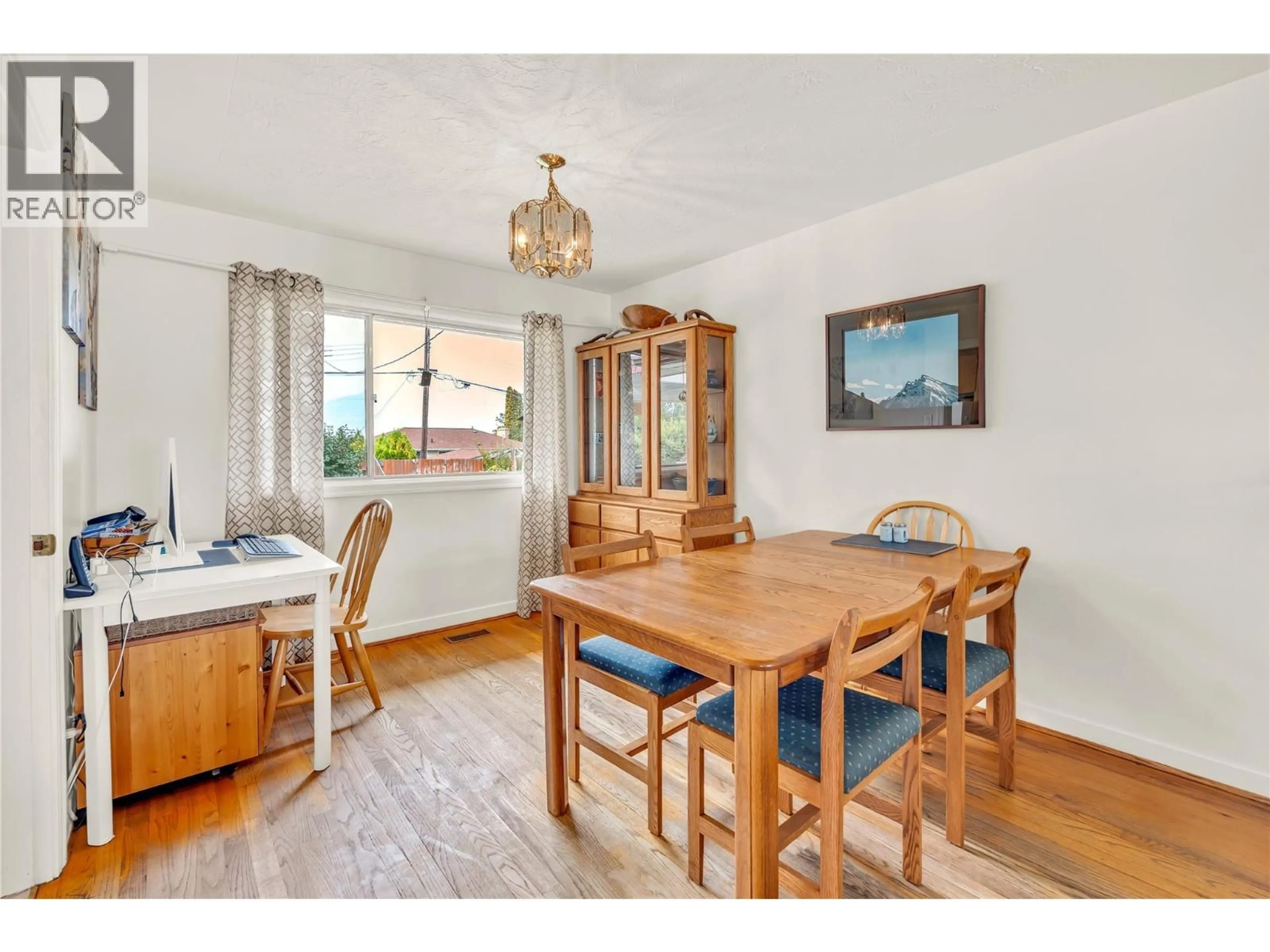 Dining room, wood/laminate floor for 1467 MANITOBA STREET, Penticton British Columbia V2A5A3