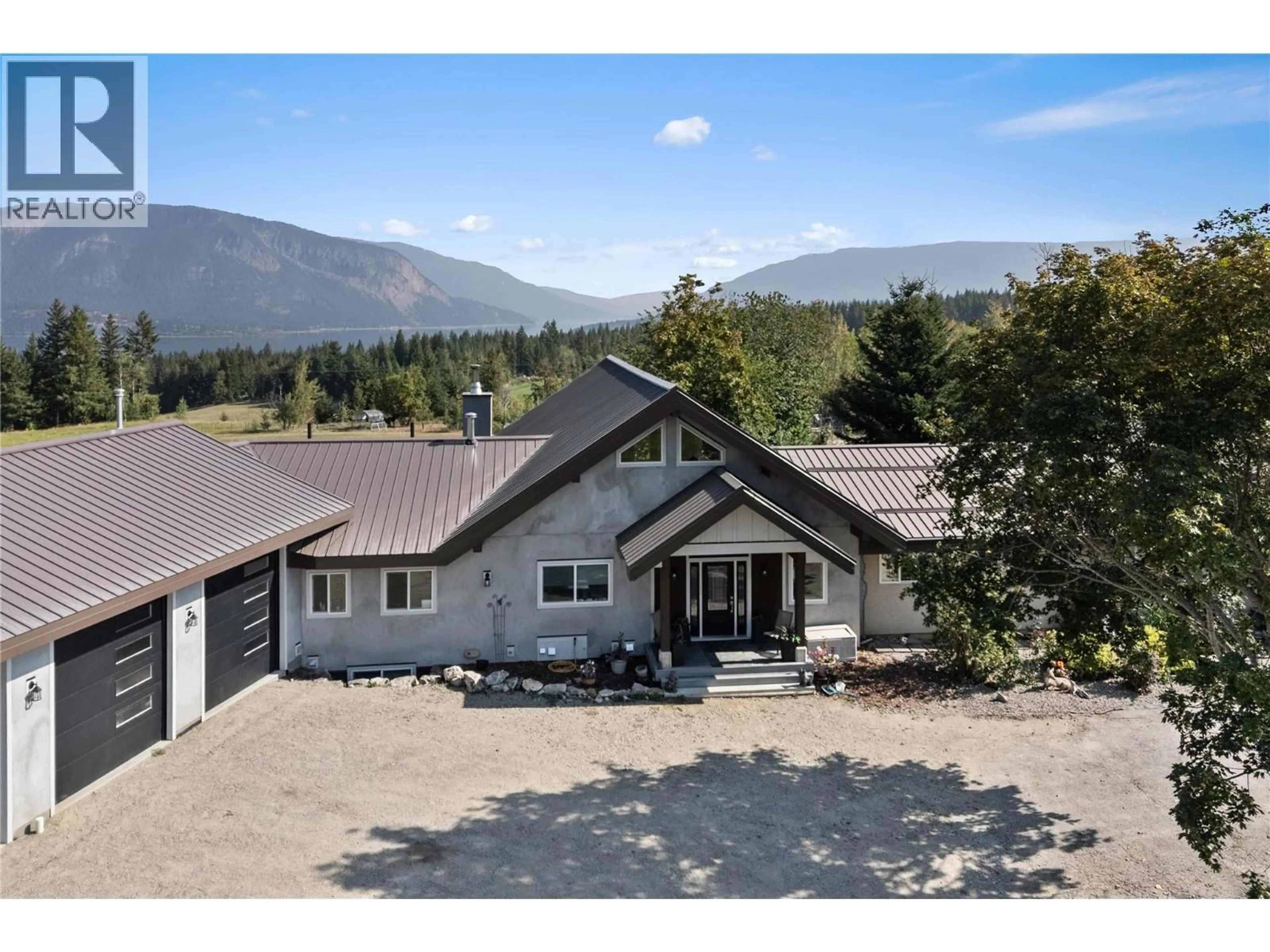 A pic from outside/outdoor area/front of a property/back of a property/a pic from drone, mountain view for 3700 50 STREET, Salmon Arm British Columbia V1E3A9