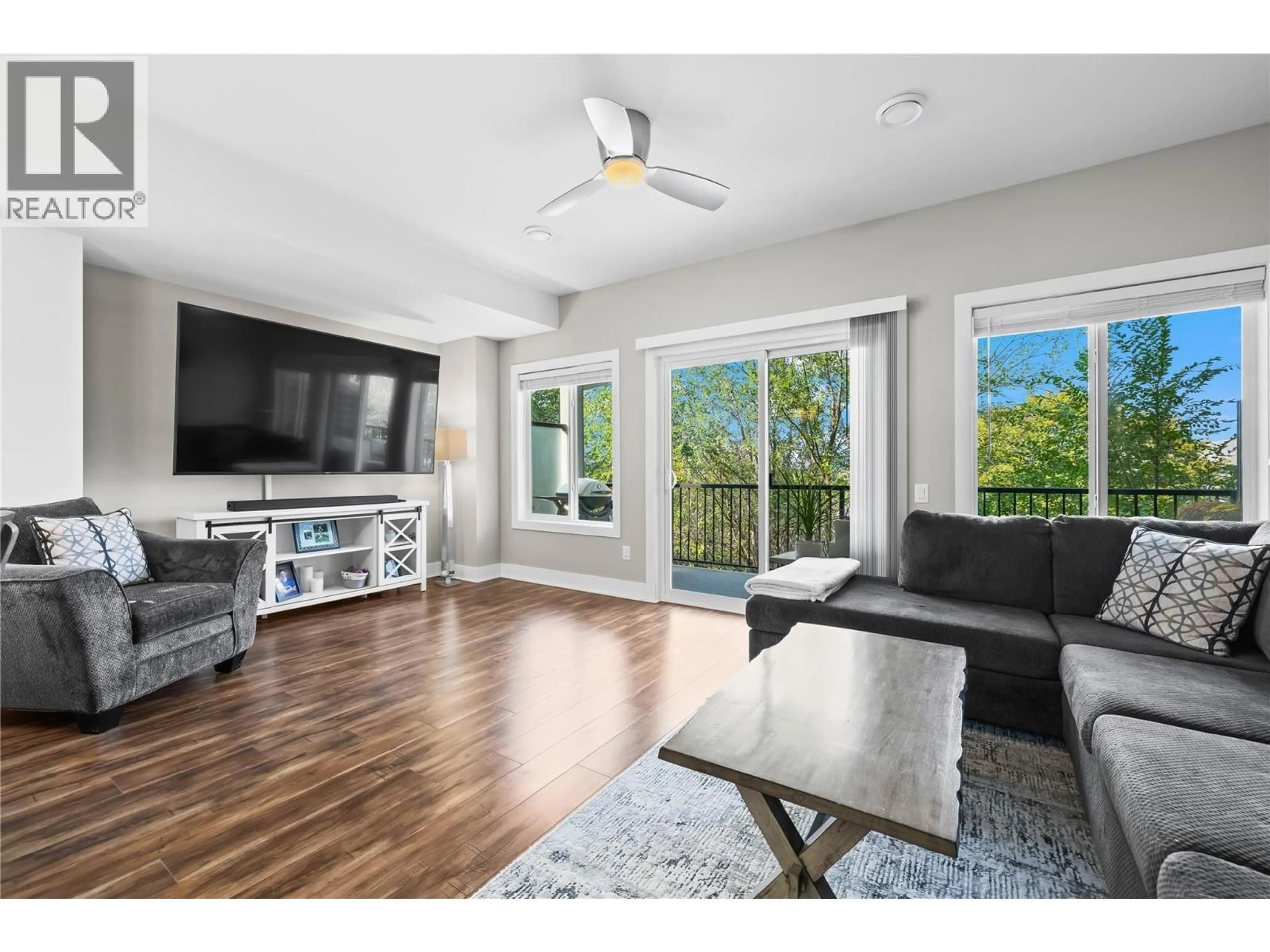 Living room with furniture, wood/laminate floor for 13 - 695 WEBSTER ROAD, Kelowna British Columbia V1X8G5