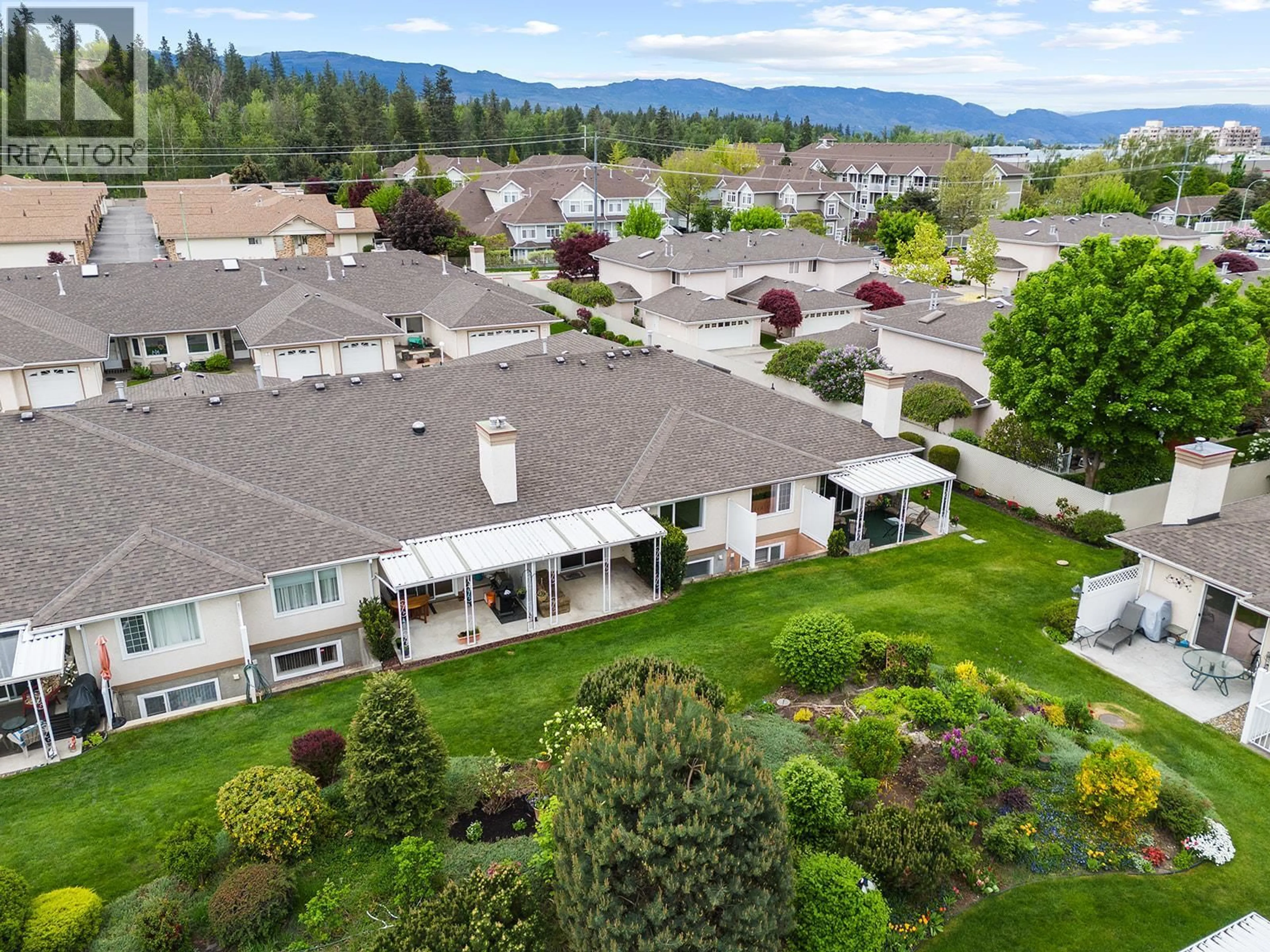 A pic from outside/outdoor area/front of a property/back of a property/a pic from drone, mountain view for 7 - 1874 PARKVIEW CRESCENT, Kelowna British Columbia V1X7G6
