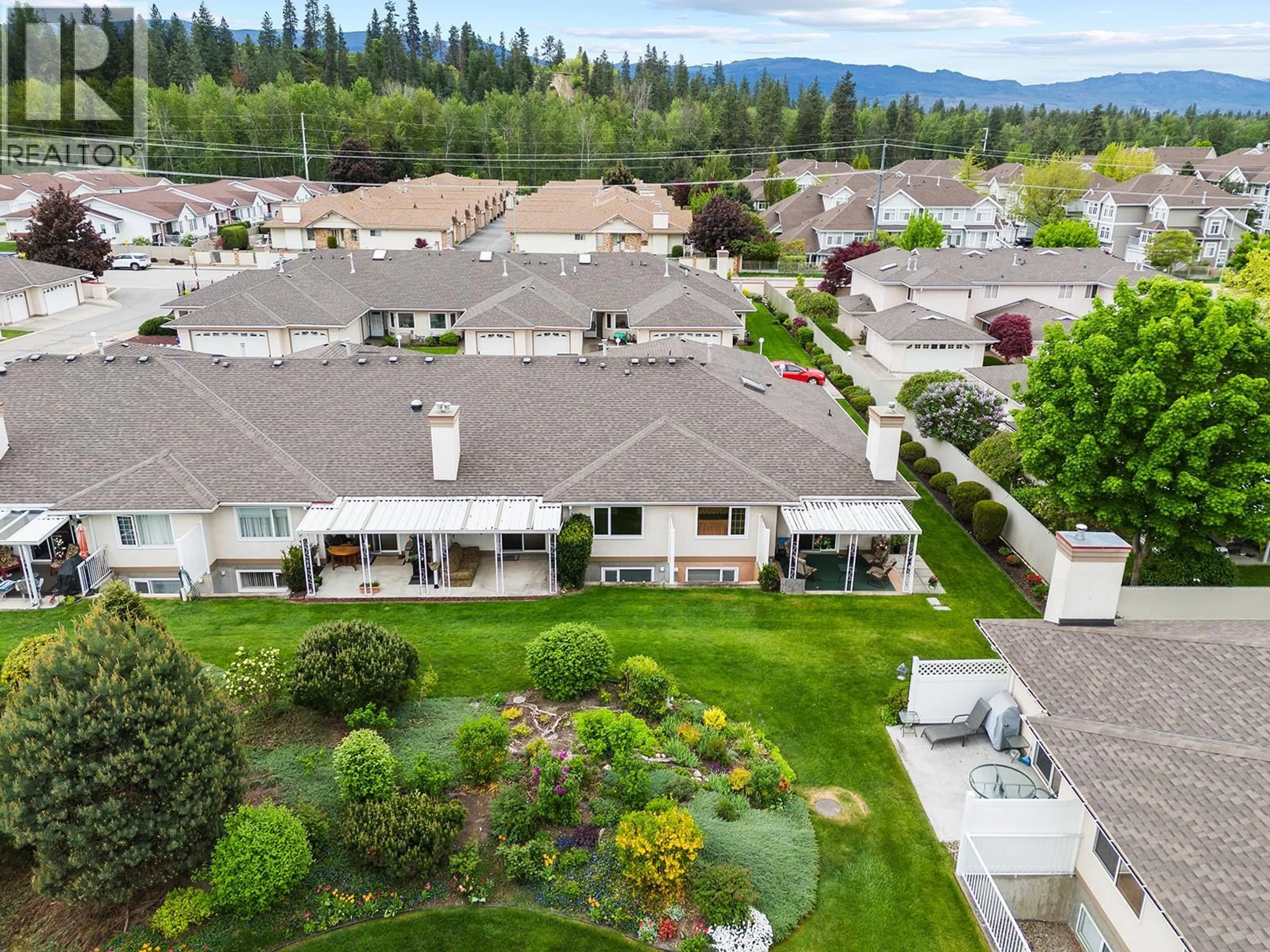 A pic from outside/outdoor area/front of a property/back of a property/a pic from drone, mountain view for 7 - 1874 PARKVIEW CRESCENT, Kelowna British Columbia V1X7G6