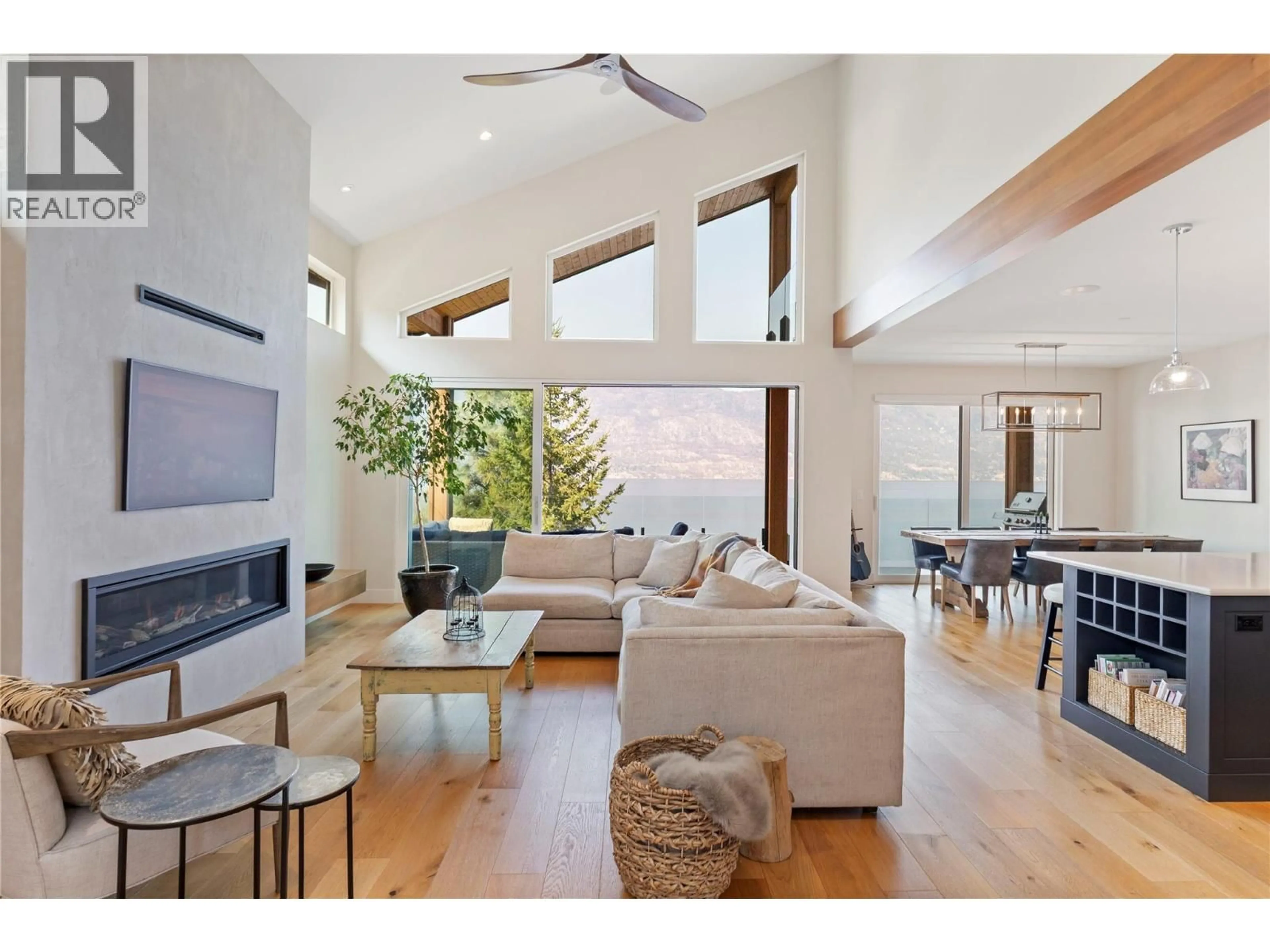 Living room with furniture, wood/laminate floor for 1526 MARBLE LEDGE DRIVE, Lake Country British Columbia V4V2T4