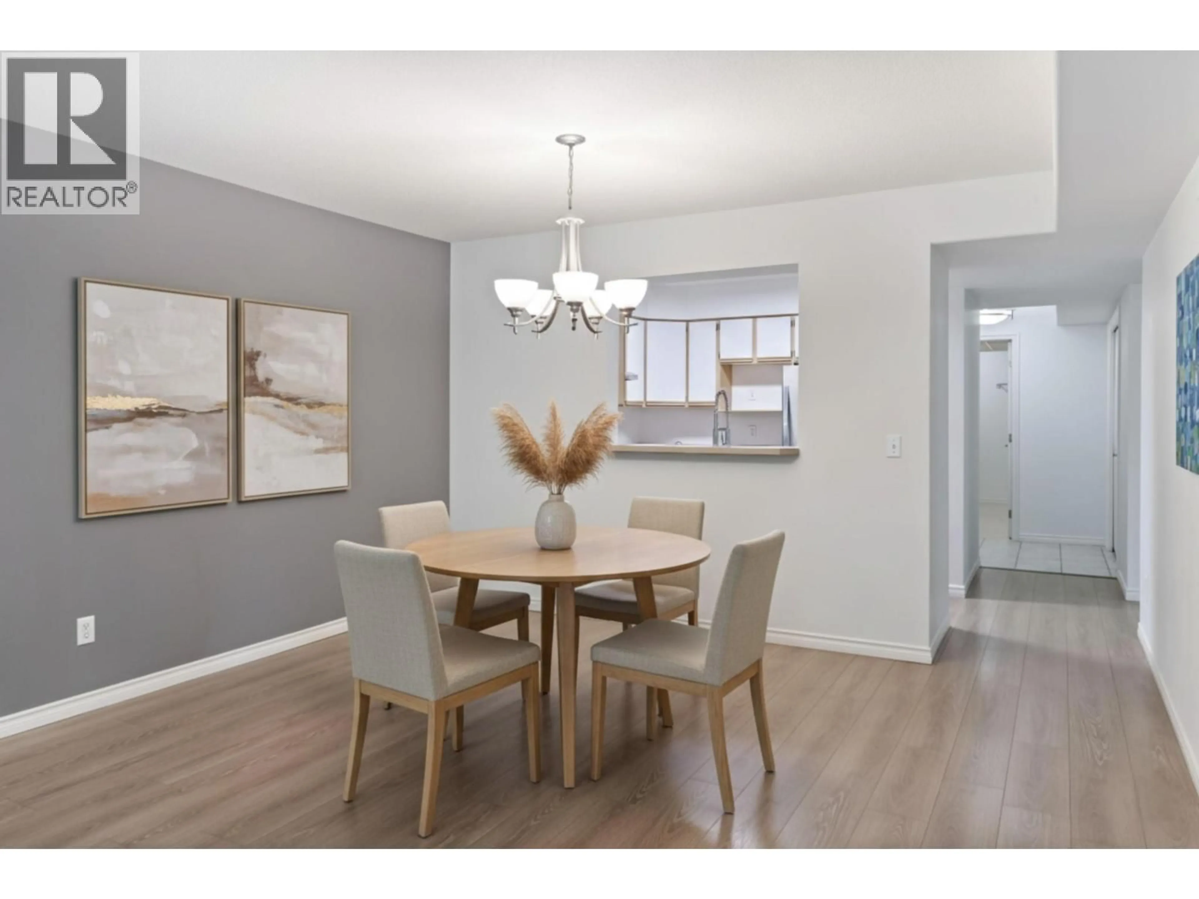 Dining room, wood/laminate floor for 101 - 265 SNOWSELL STREET, Kelowna British Columbia V1V1V6