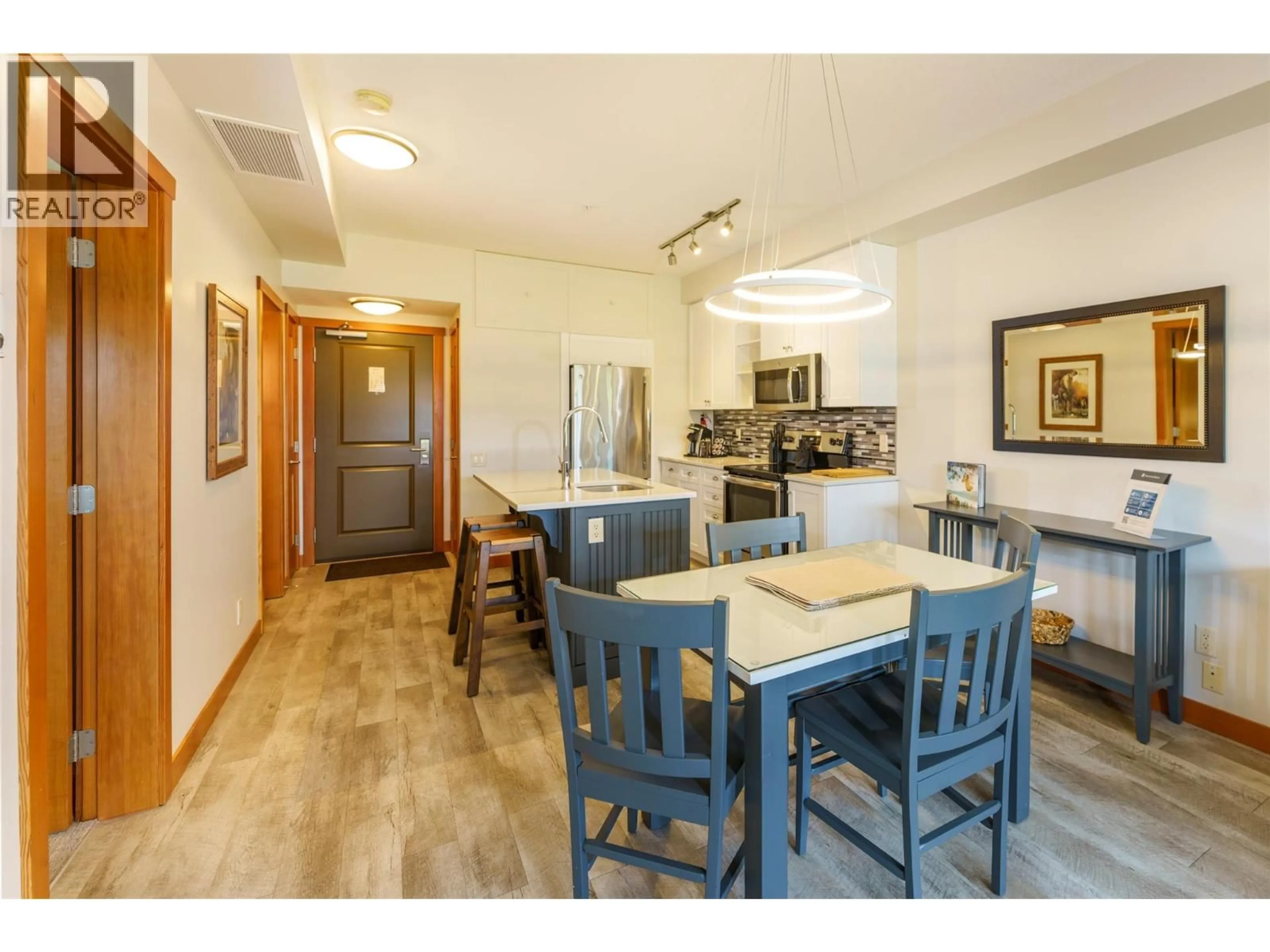 Dining room, wood/laminate floor for 324 - 105 VILLAGE CENTRE COURT, Vernon British Columbia V1H1Y8