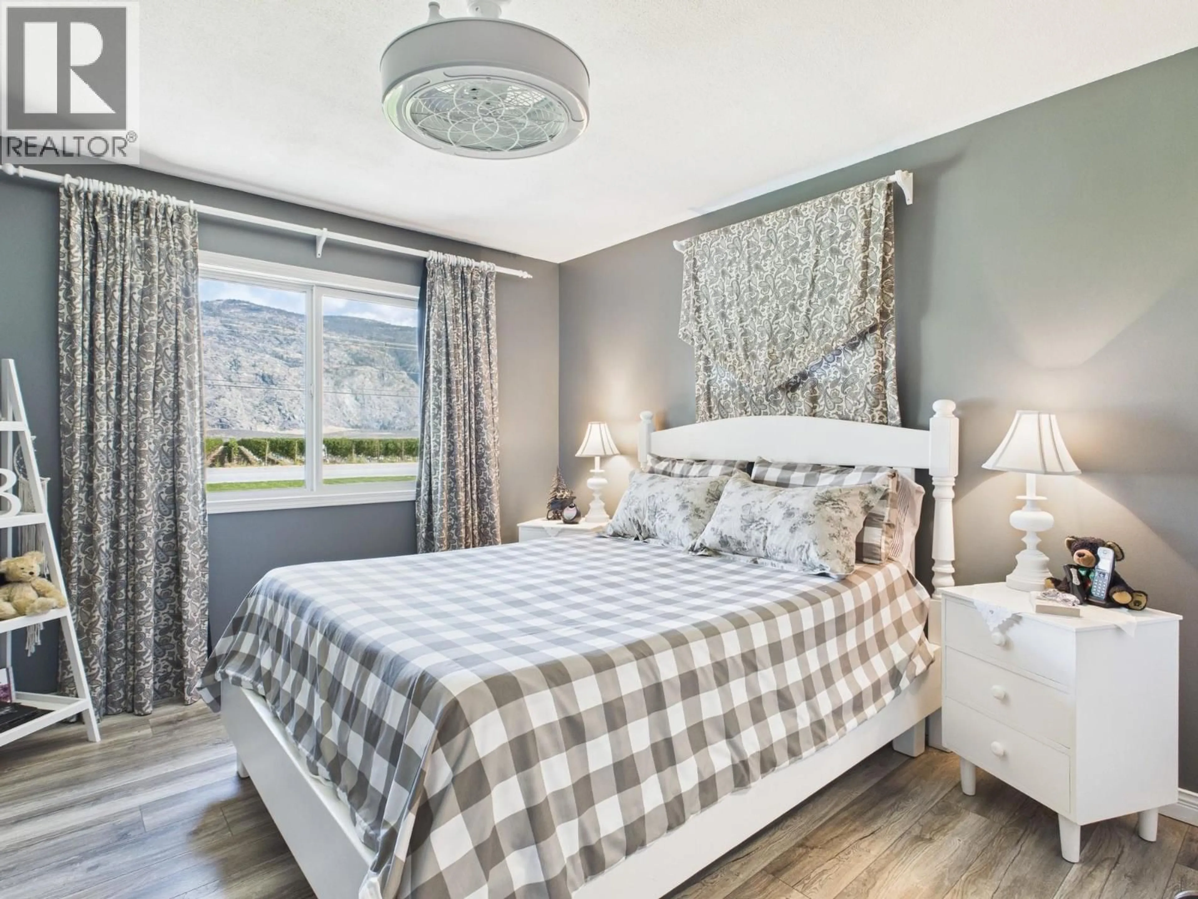 Bedroom with bed, wood/laminate floor for 9806 HIGHWAY 97 OTHER, Osoyoos British Columbia V0H1V2