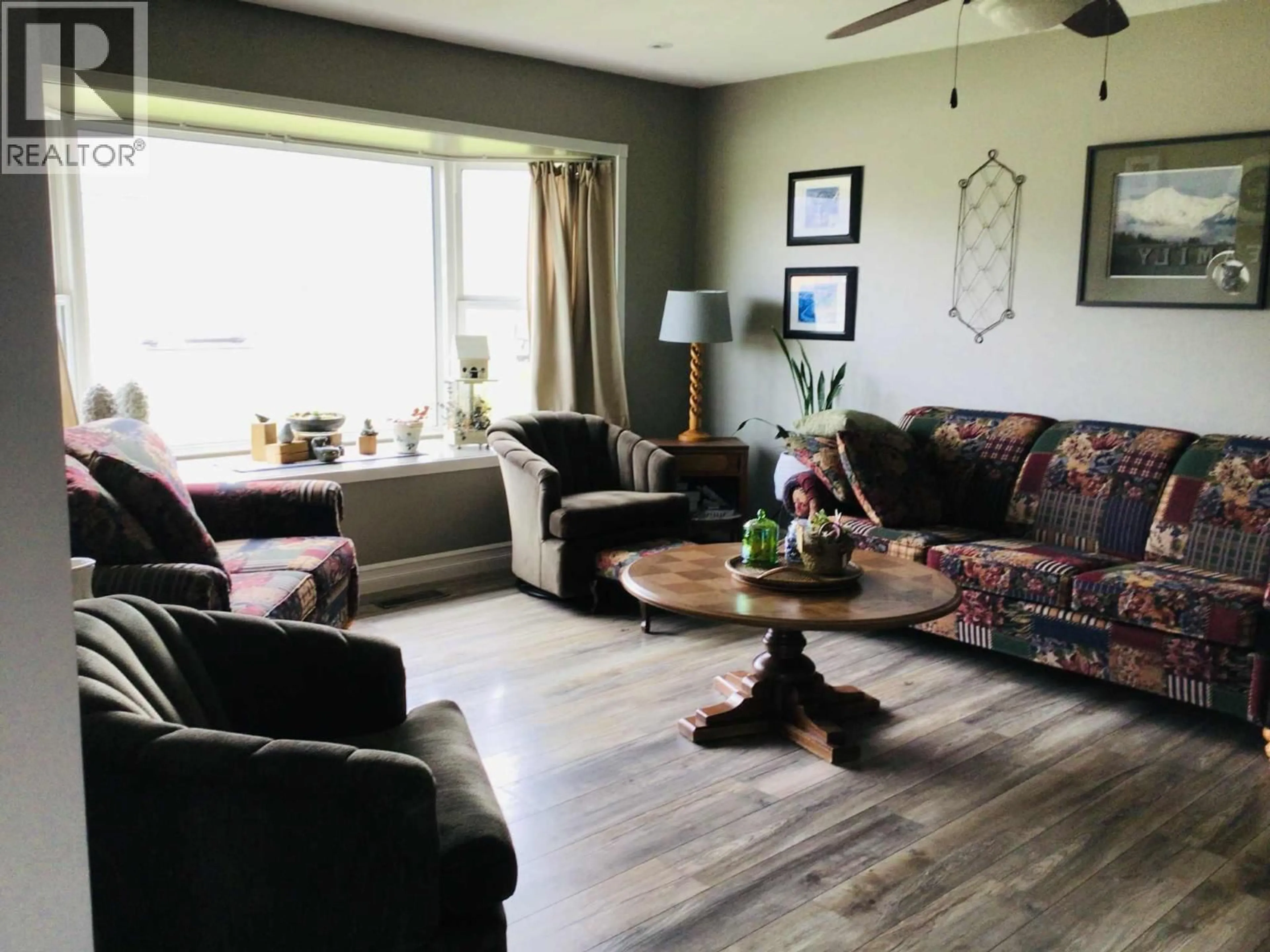 Living room with furniture, wood/laminate floor for 9806 HIGHWAY 97 OTHER, Osoyoos British Columbia V0H1V2