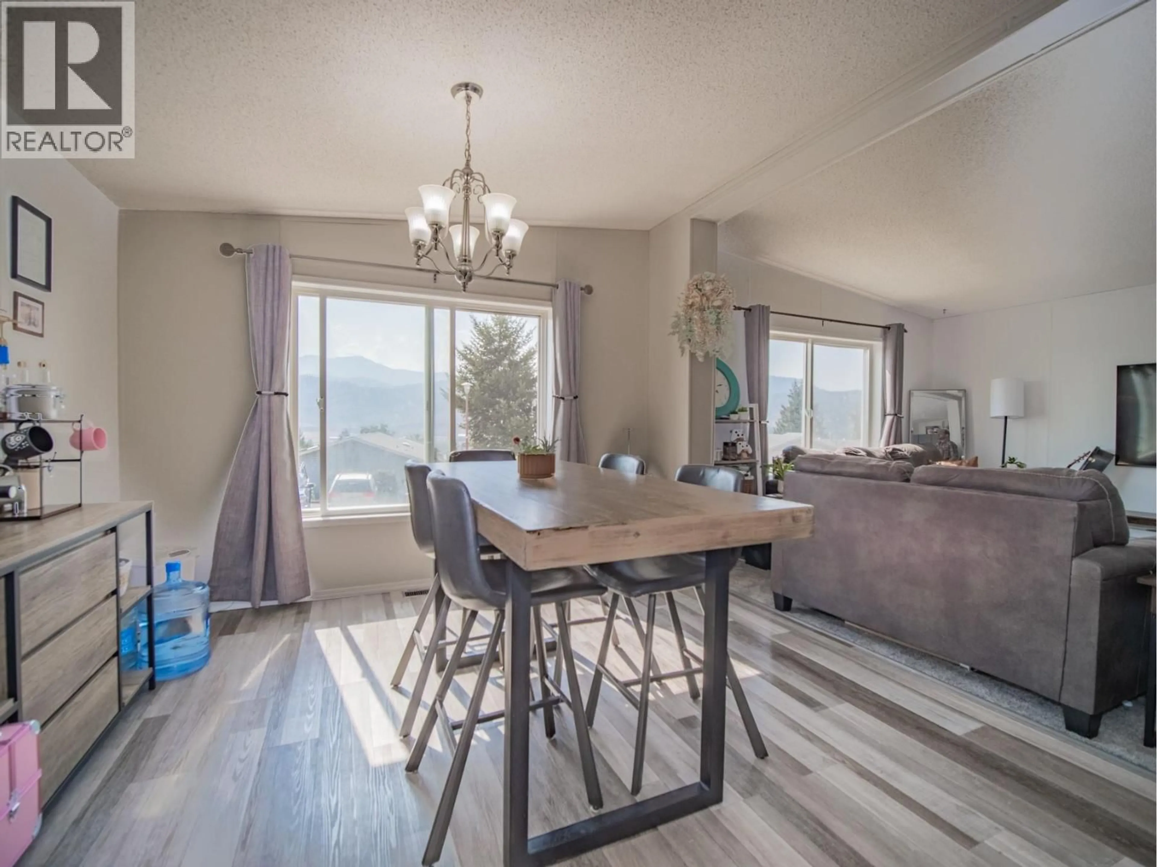 Dining room, wood/laminate floor for 52 - 3099 SHUSWAP  E ROAD, Kamloops British Columbia V2H1T7