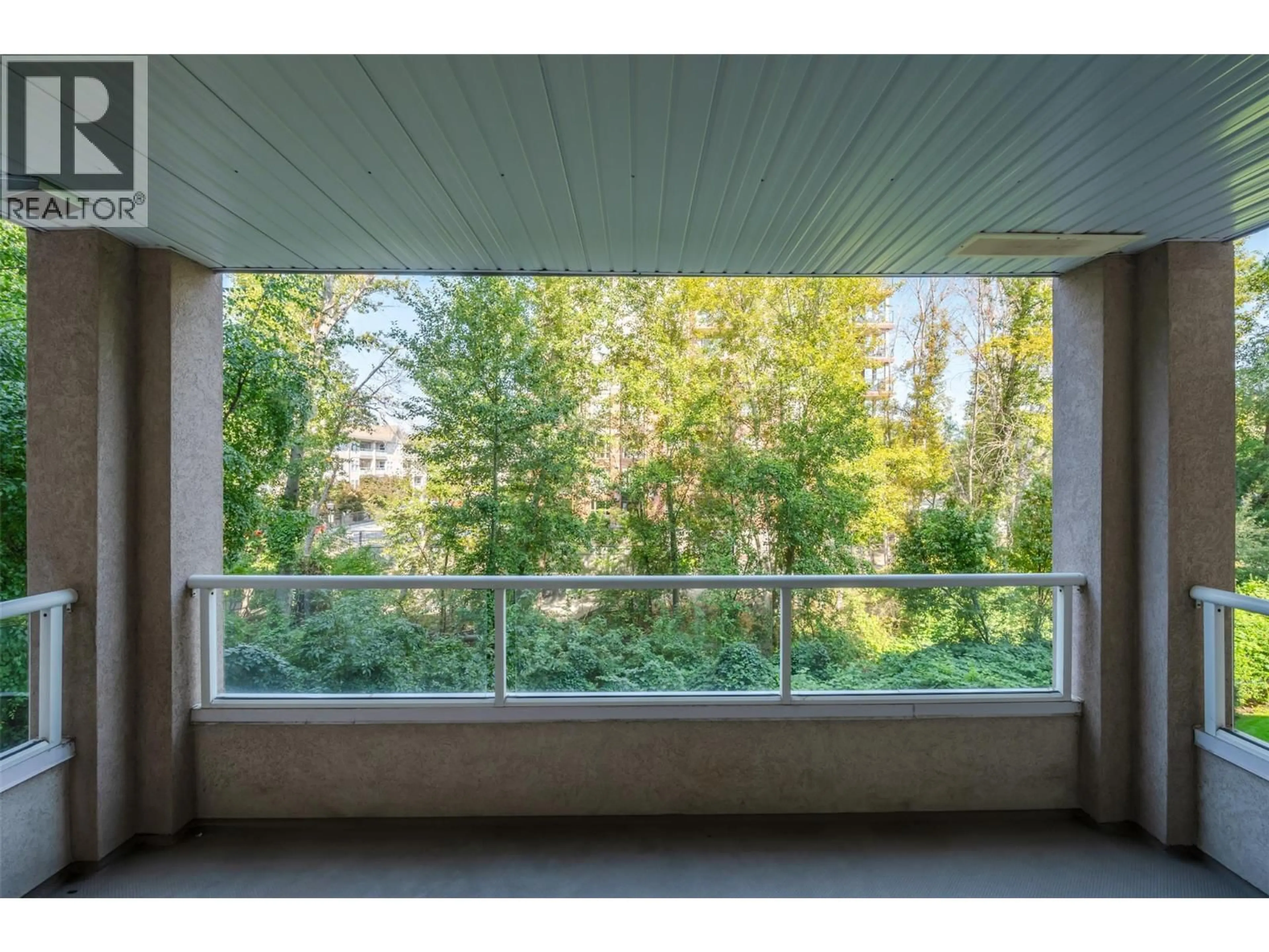 Balcony in the apartment, forest/trees view for 205 - 2245 ATKINSON STREET, Penticton British Columbia V2A8R7