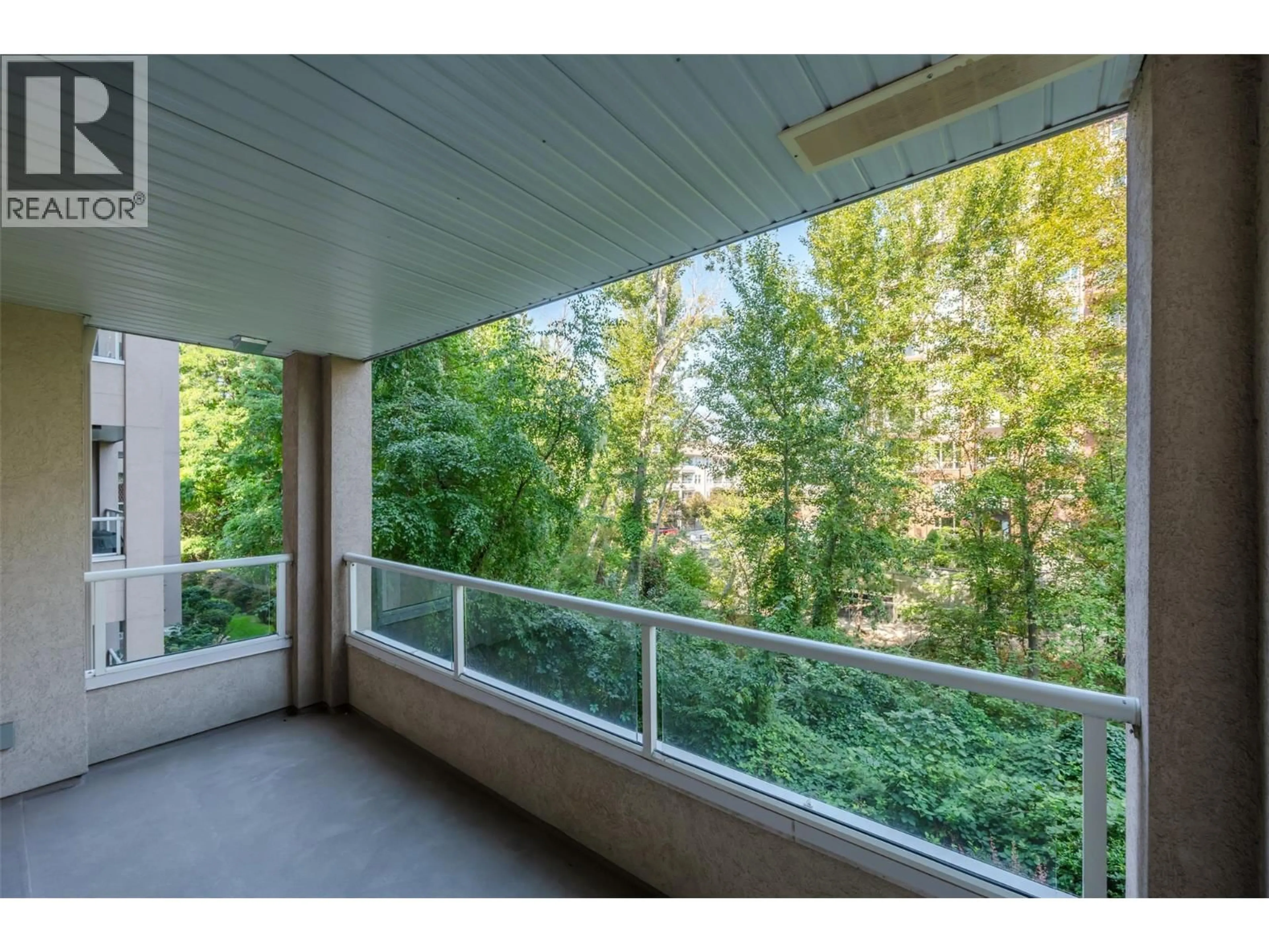 Balcony in the apartment, forest/trees view for 205 - 2245 ATKINSON STREET, Penticton British Columbia V2A8R7