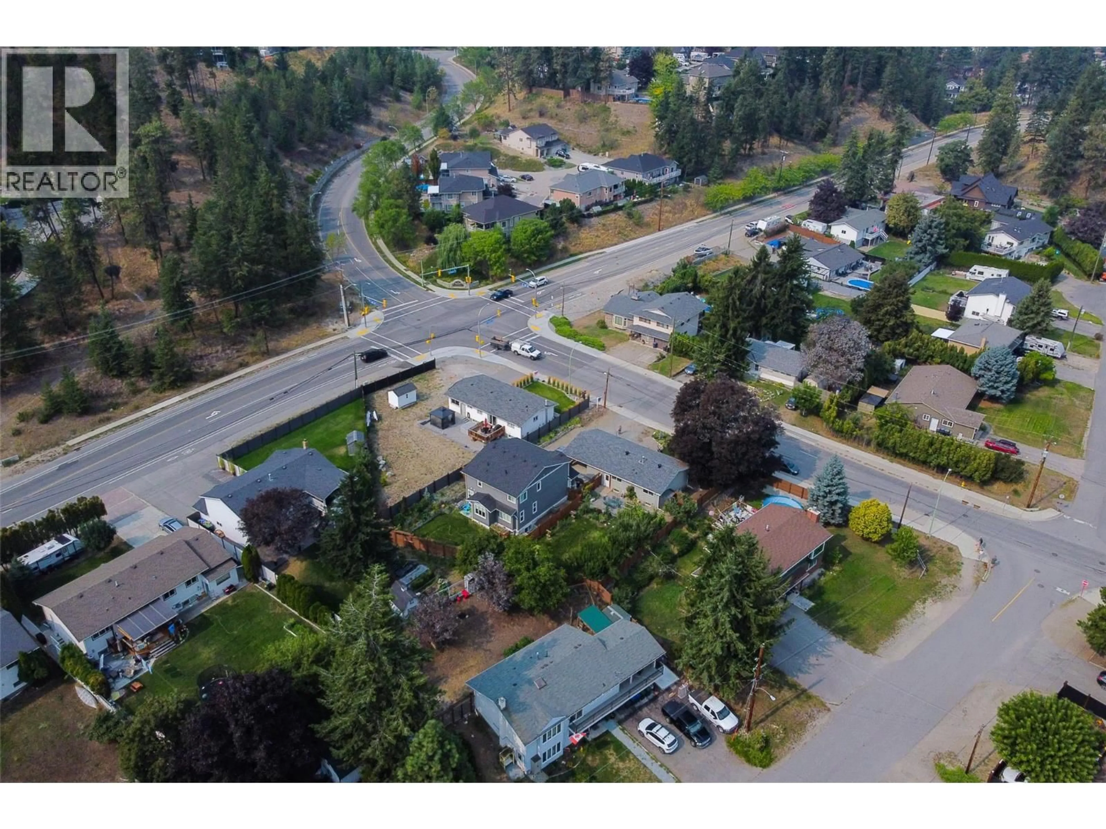 A pic from outside/outdoor area/front of a property/back of a property/a pic from drone, street for RIO DRIVE, Kelowna British Columbia V1V1E2