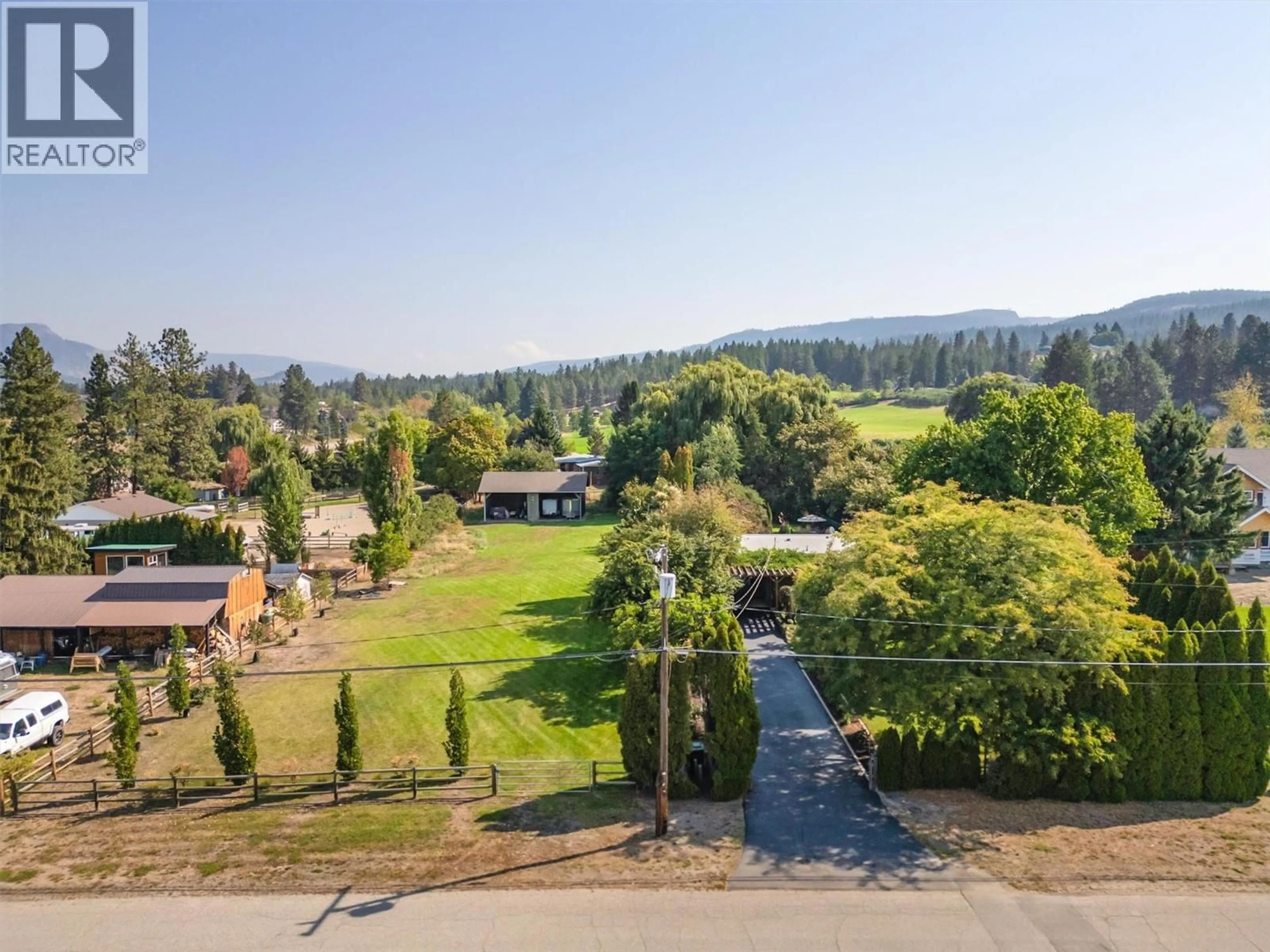 A pic from outside/outdoor area/front of a property/back of a property/a pic from drone, mountain view for 4233 JAUD ROAD, Kelowna British Columbia V1W4C5