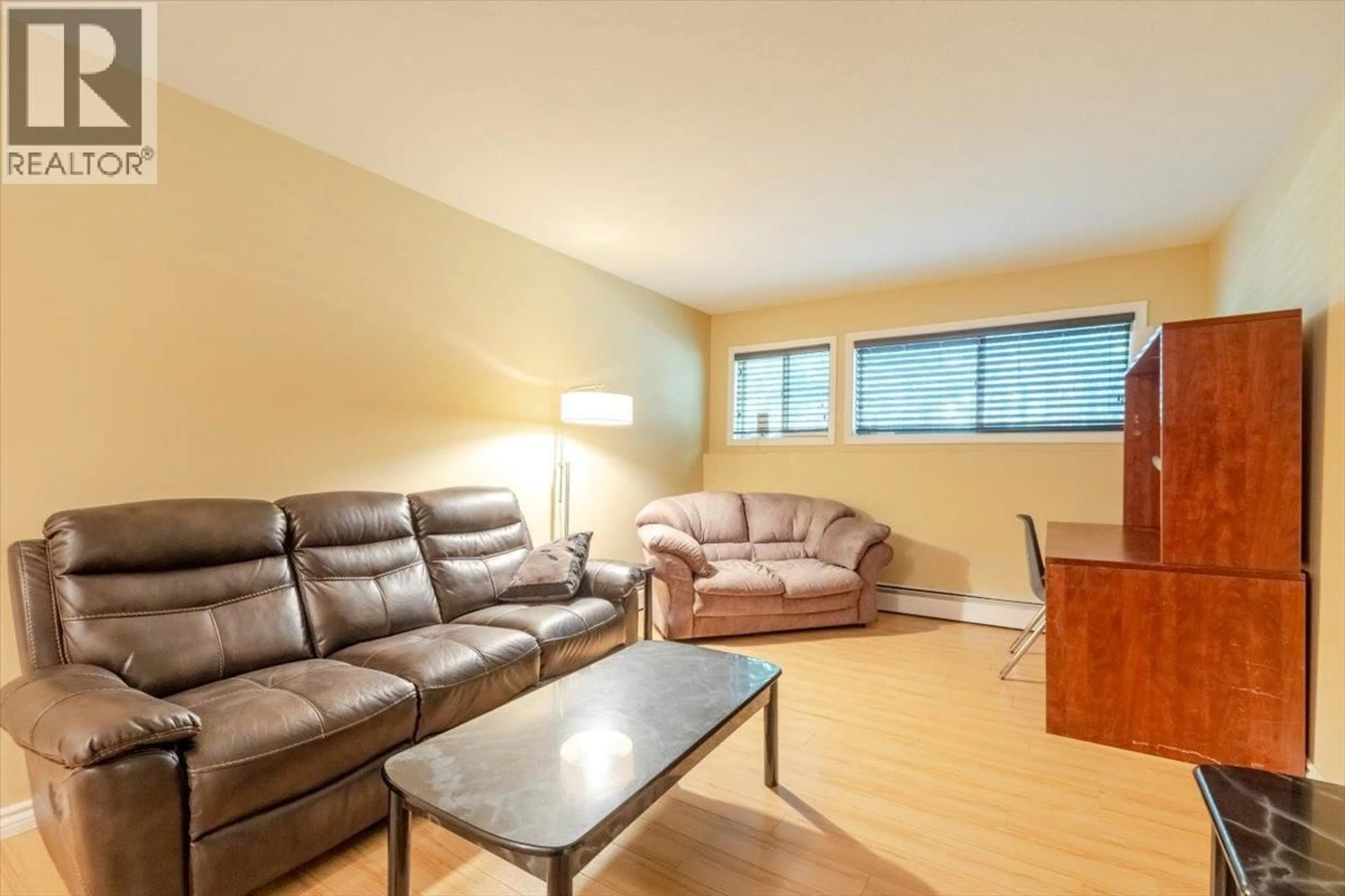 Living room with furniture, wood/laminate floor for 105B - 1299 PONDEROSA DRIVE, Sparwood British Columbia V0B2G2