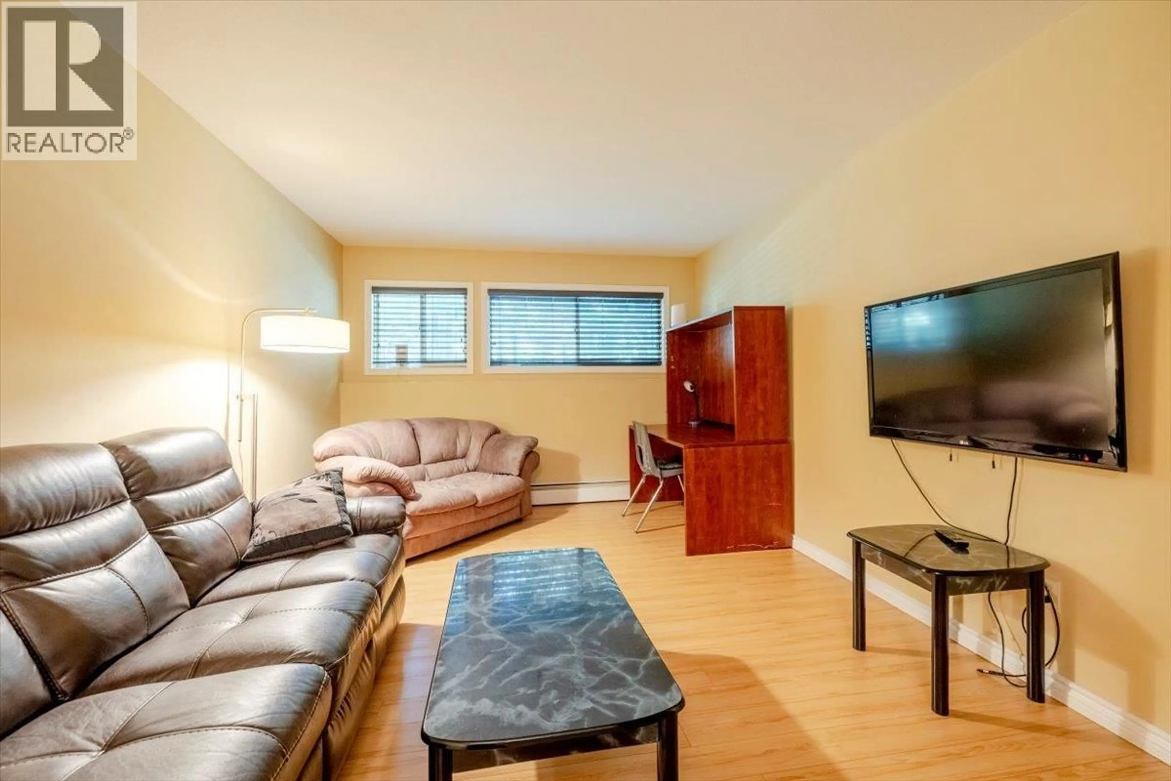 Living room with furniture, wood/laminate floor for 105B - 1299 PONDEROSA DRIVE, Sparwood British Columbia V0B2G2