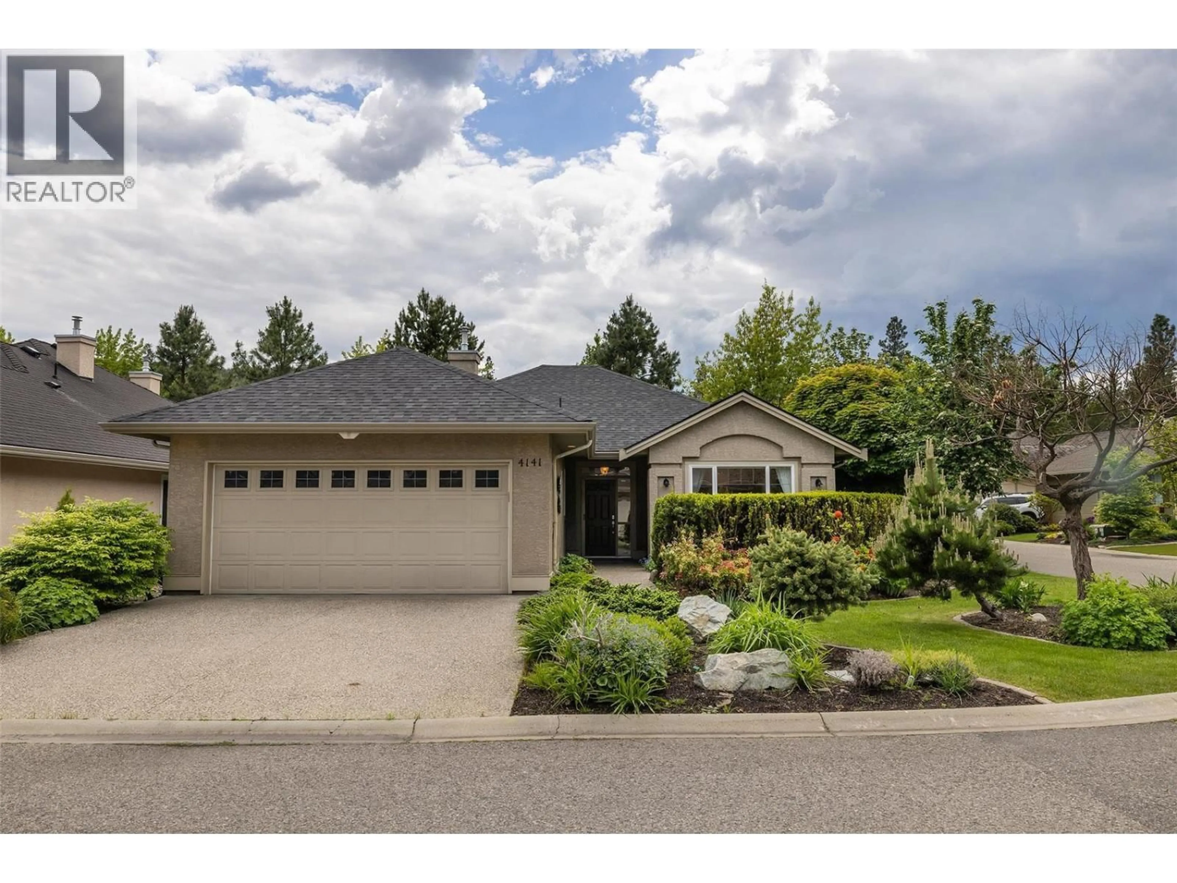Home with vinyl exterior material, street for 4141 GALLAGHERS FOREST ROAD SOUTH, Kelowna British Columbia V1W5E4