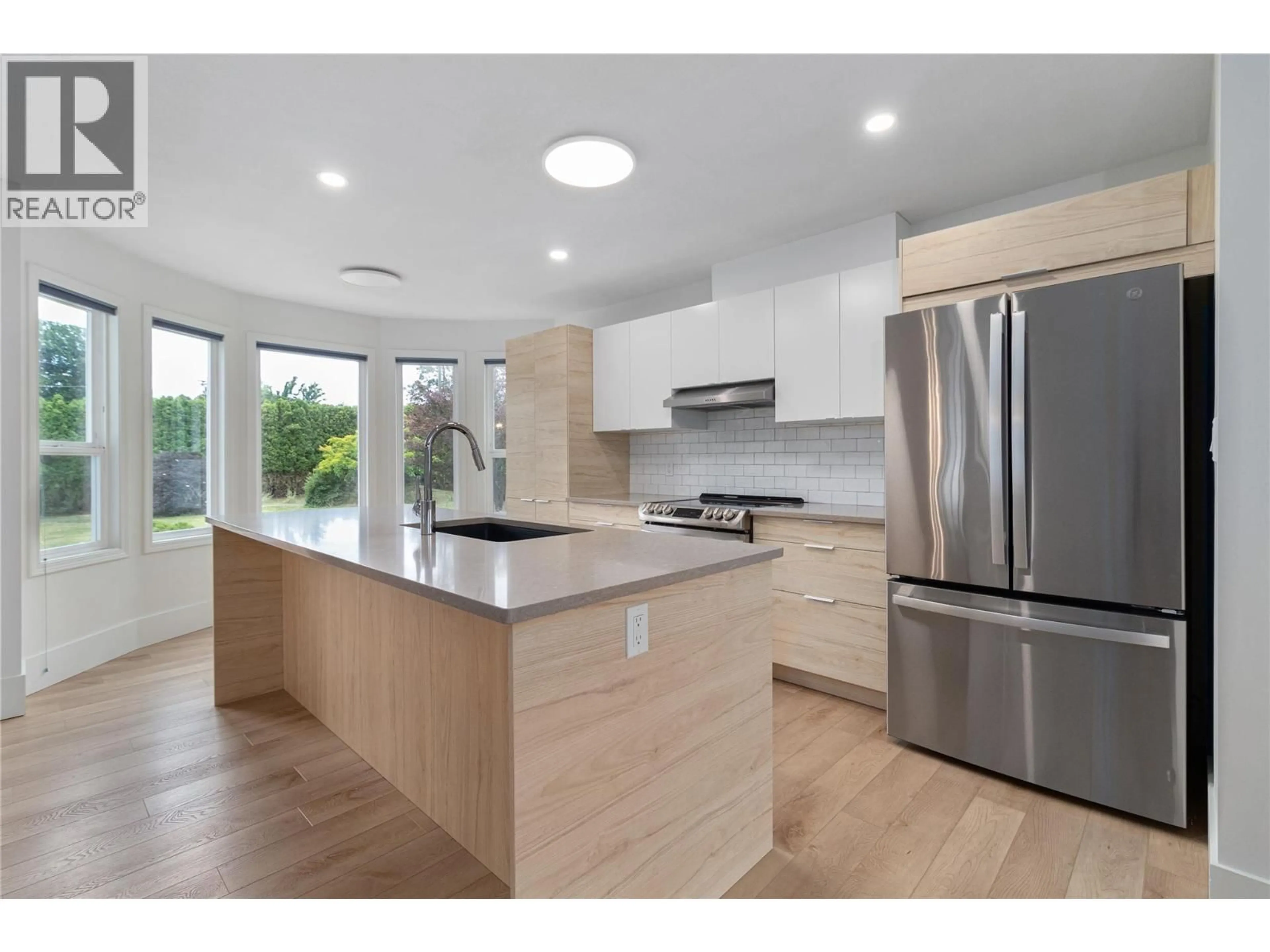 Open concept kitchen, wood/laminate floor for 810 WESTBROOK DRIVE, West Kelowna British Columbia V1Z1R3