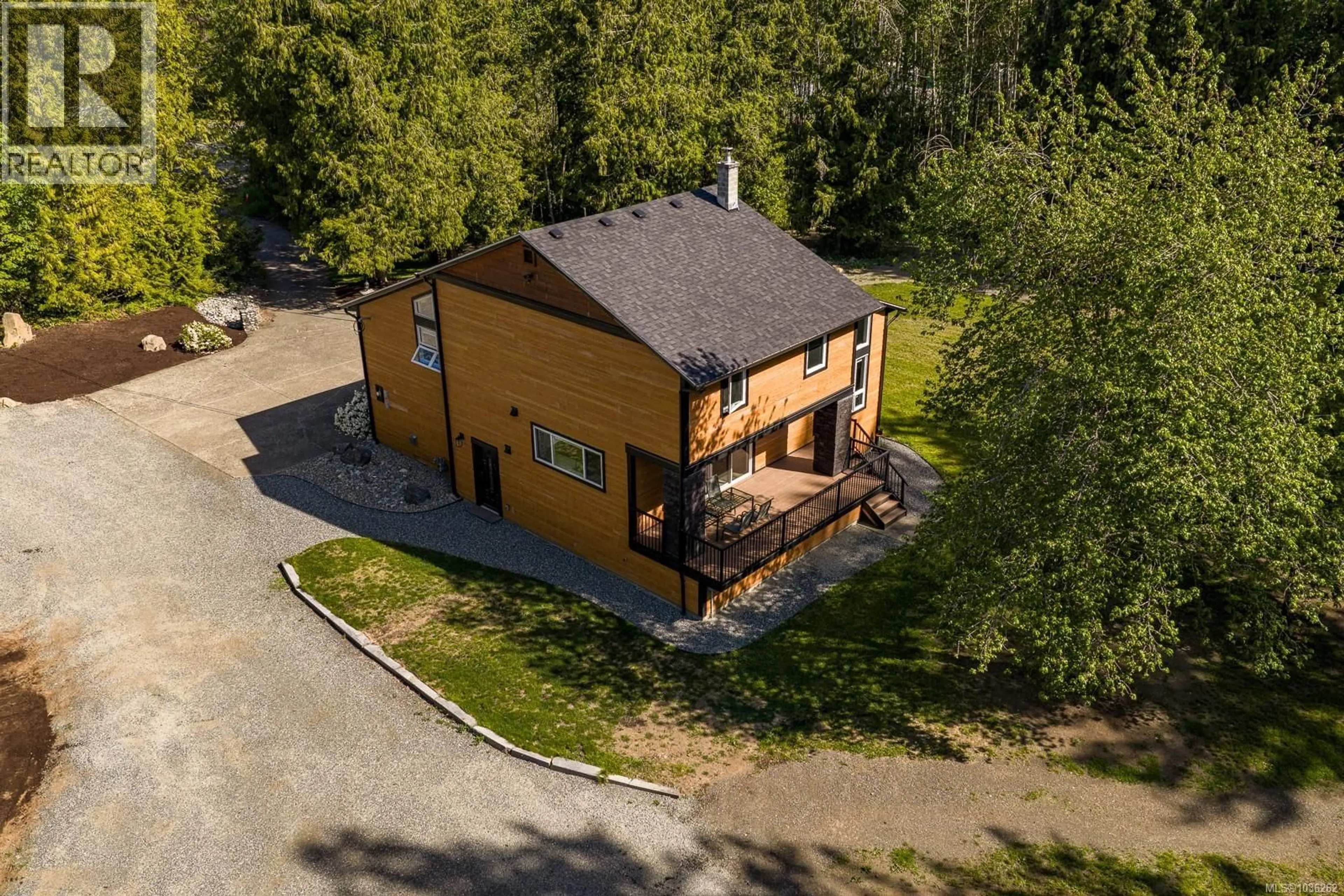 A pic from outside/outdoor area/front of a property/back of a property/a pic from drone, building for 3550 CUMBERLAND ROAD, Cumberland British Columbia V0R1S0
