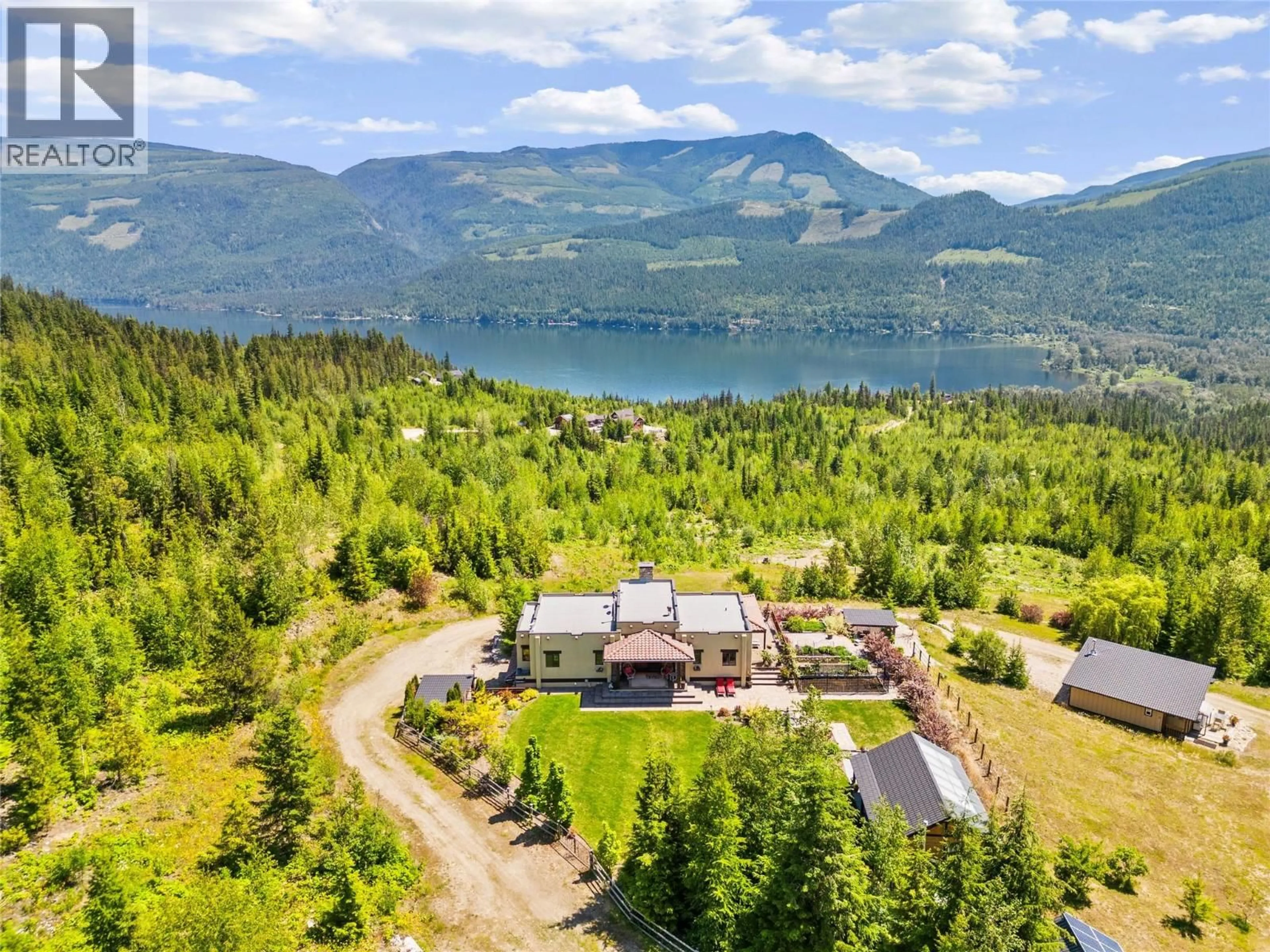 A pic from outside/outdoor area/front of a property/back of a property/a pic from drone, water/lake/river/ocean view for 1309 EAGLE RIDGE ROAD, Lumby British Columbia V0E2G4