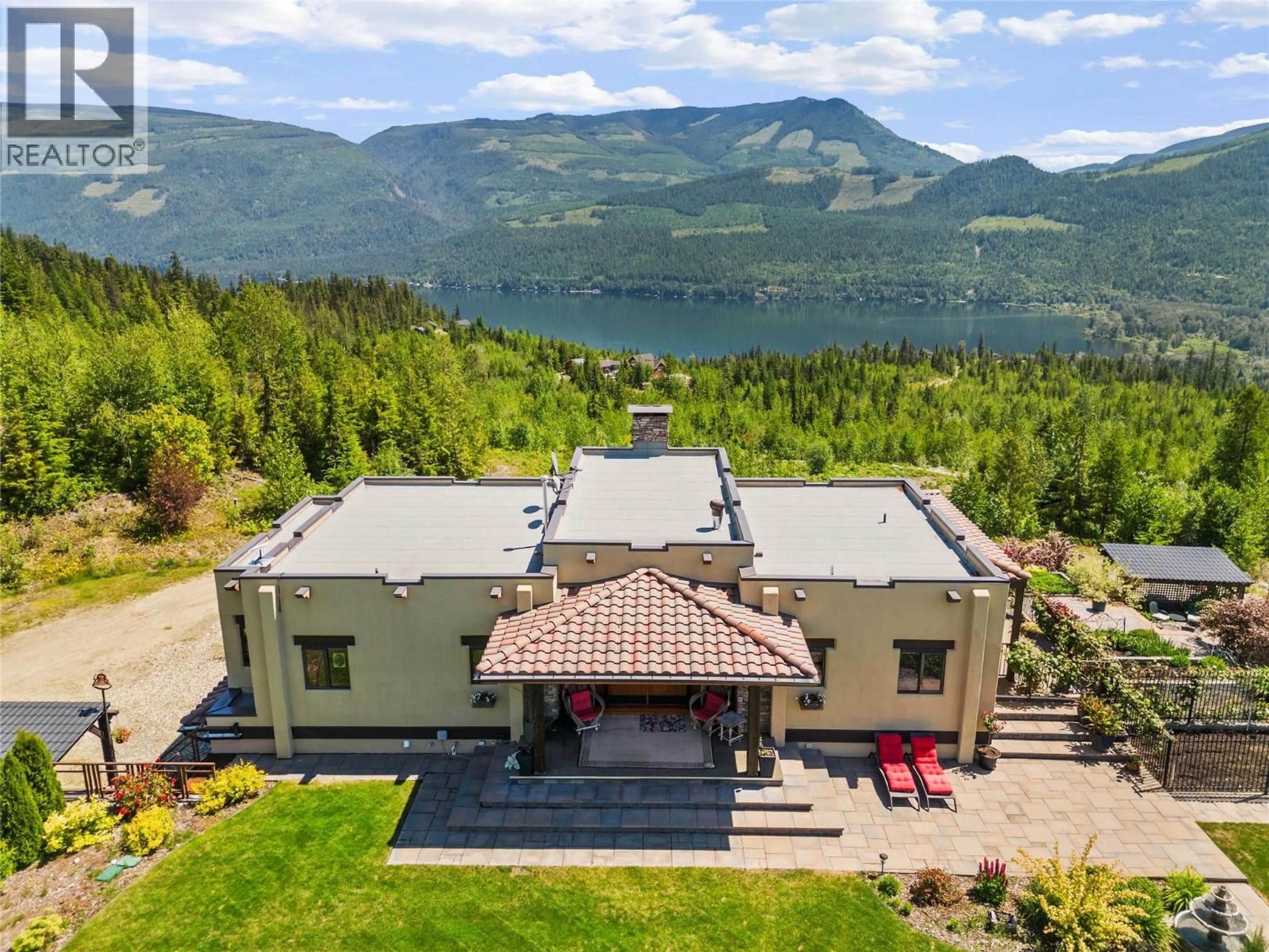 A pic from outside/outdoor area/front of a property/back of a property/a pic from drone, mountain view for 1309 EAGLE RIDGE ROAD, Lumby British Columbia V0E2G4