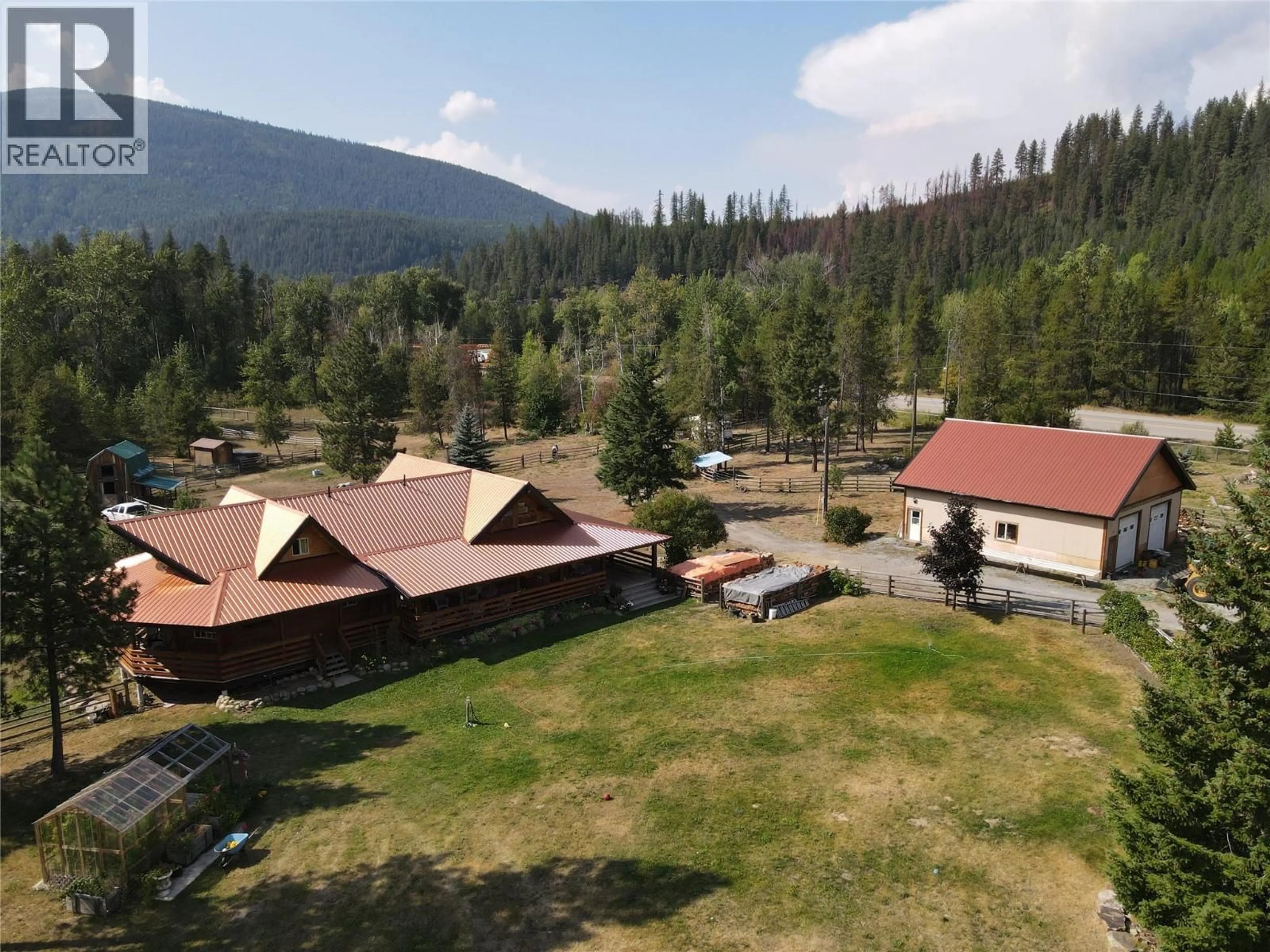 A pic from outside/outdoor area/front of a property/back of a property/a pic from drone, mountain view for 8495 3 HIGHWAY, Yahk British Columbia V0B2P0