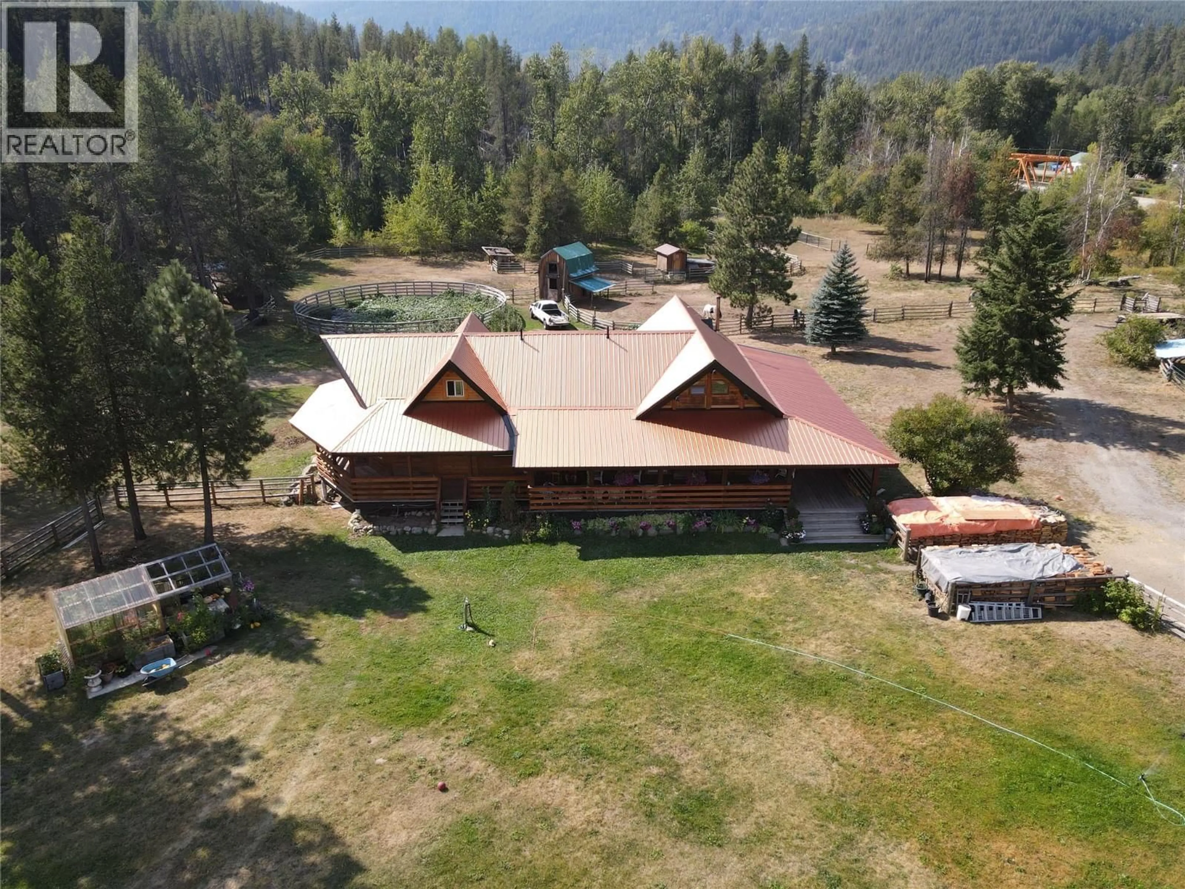 A pic from outside/outdoor area/front of a property/back of a property/a pic from drone, mountain view for 8495 3 HIGHWAY, Yahk British Columbia V0B2P0