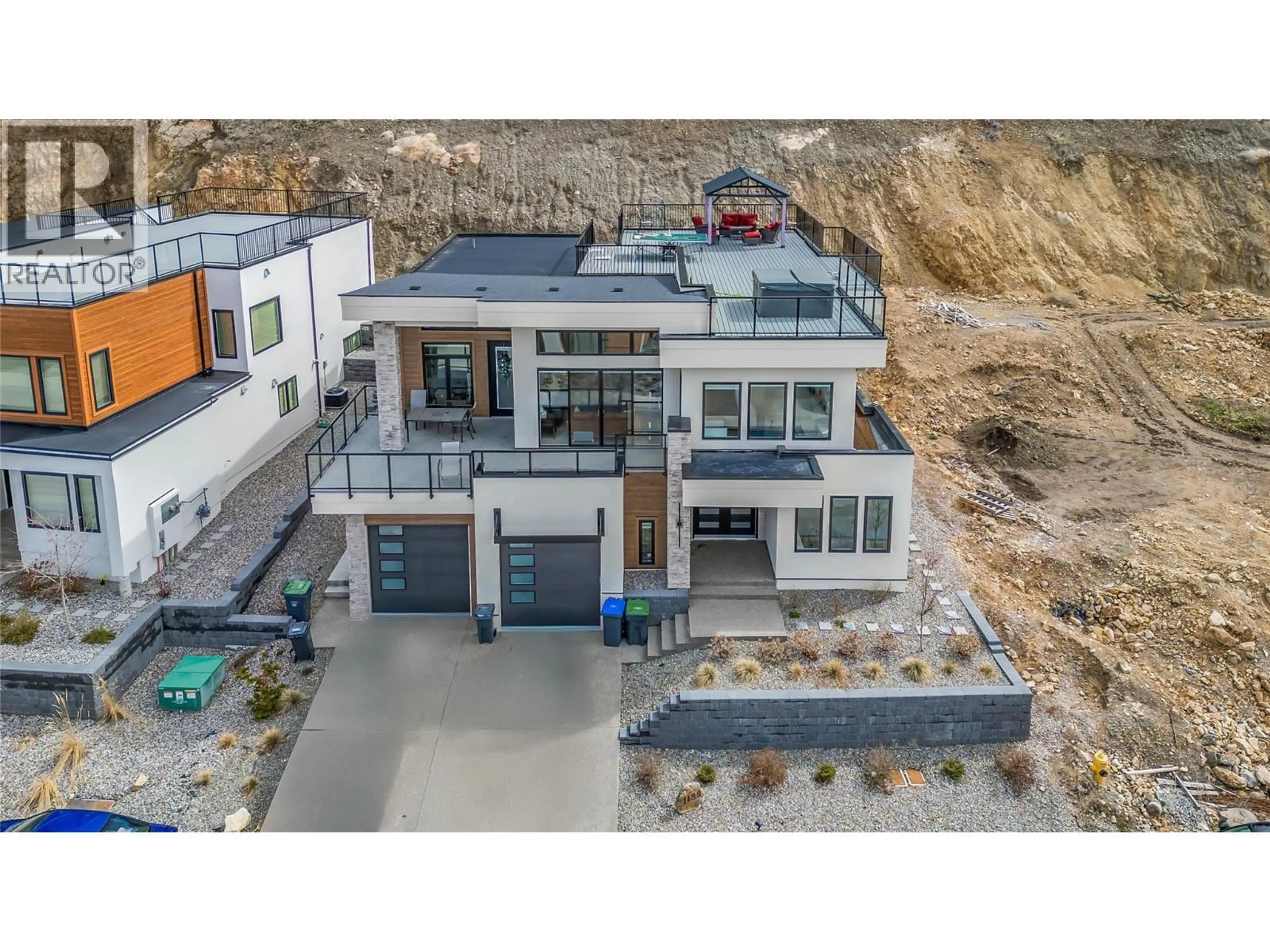 A pic from outside/outdoor area/front of a property/back of a property/a pic from drone, street for 1189 LONE PINE DRIVE, Kelowna British Columbia V1P0A5