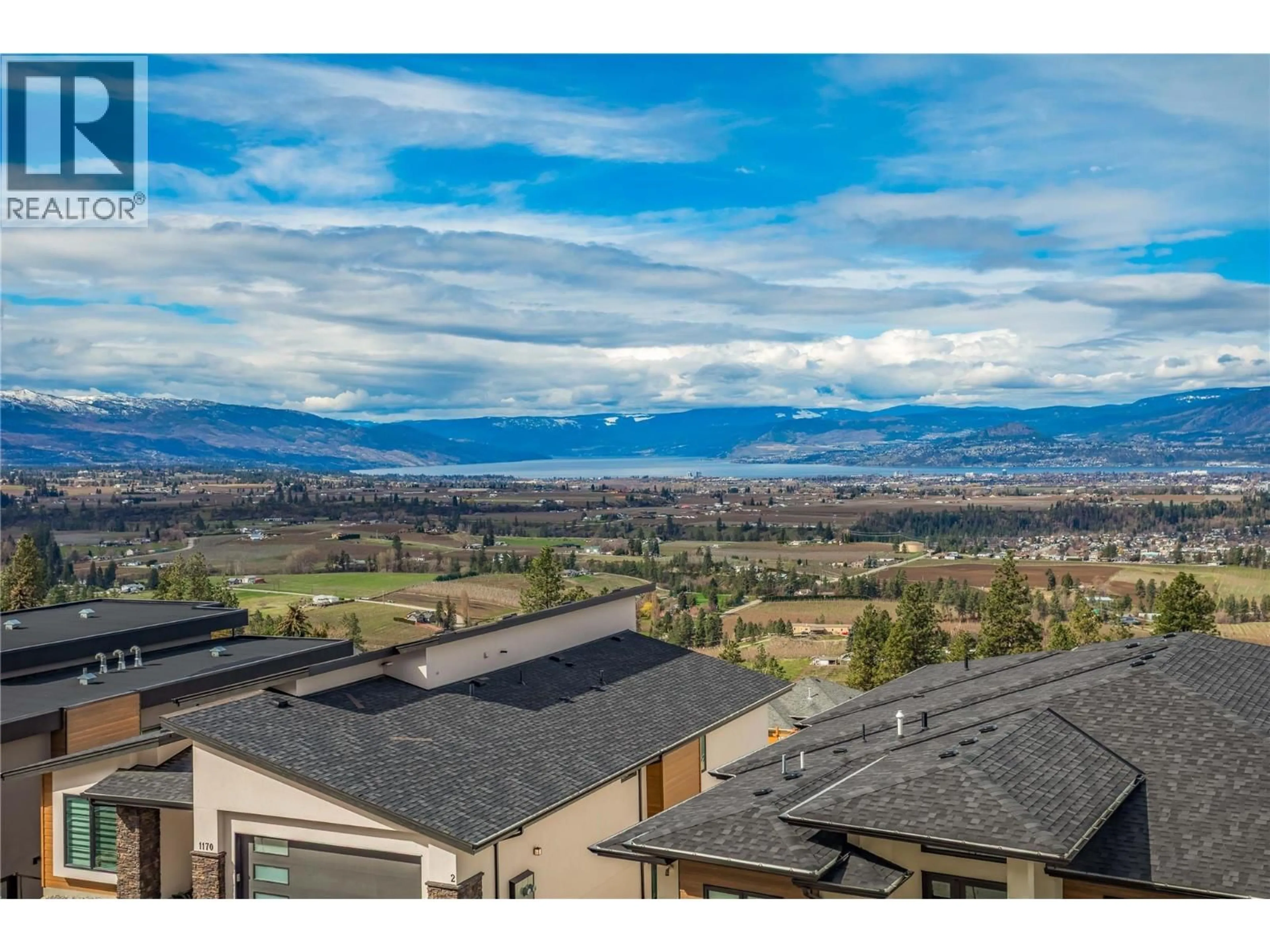 A pic from outside/outdoor area/front of a property/back of a property/a pic from drone, mountain view for 1189 LONE PINE DRIVE, Kelowna British Columbia V1P0A5