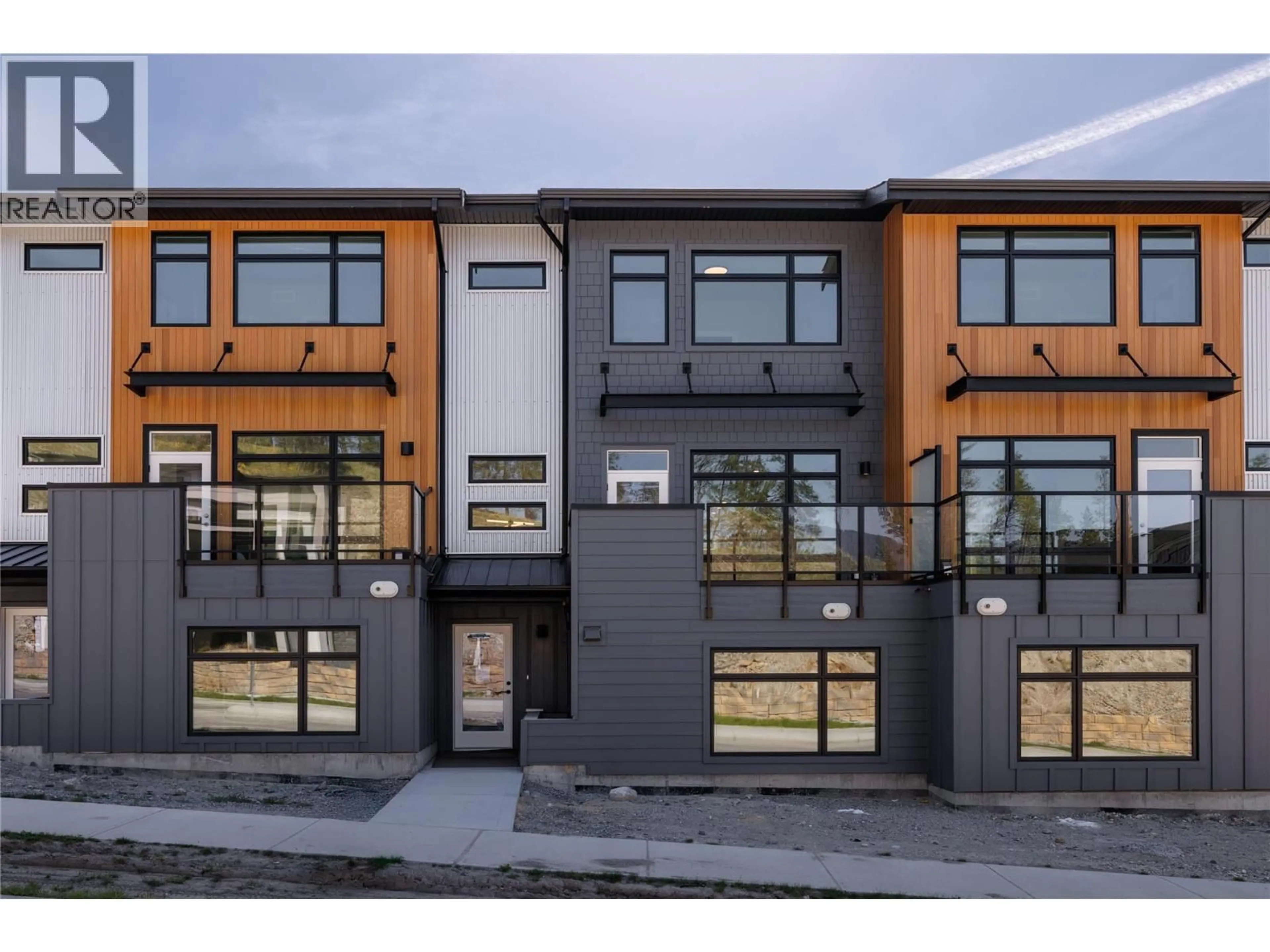 Home with brick exterior material, street for 2 - 3425 HILLTOWN DRIVE, Kelowna British Columbia V1V2B5