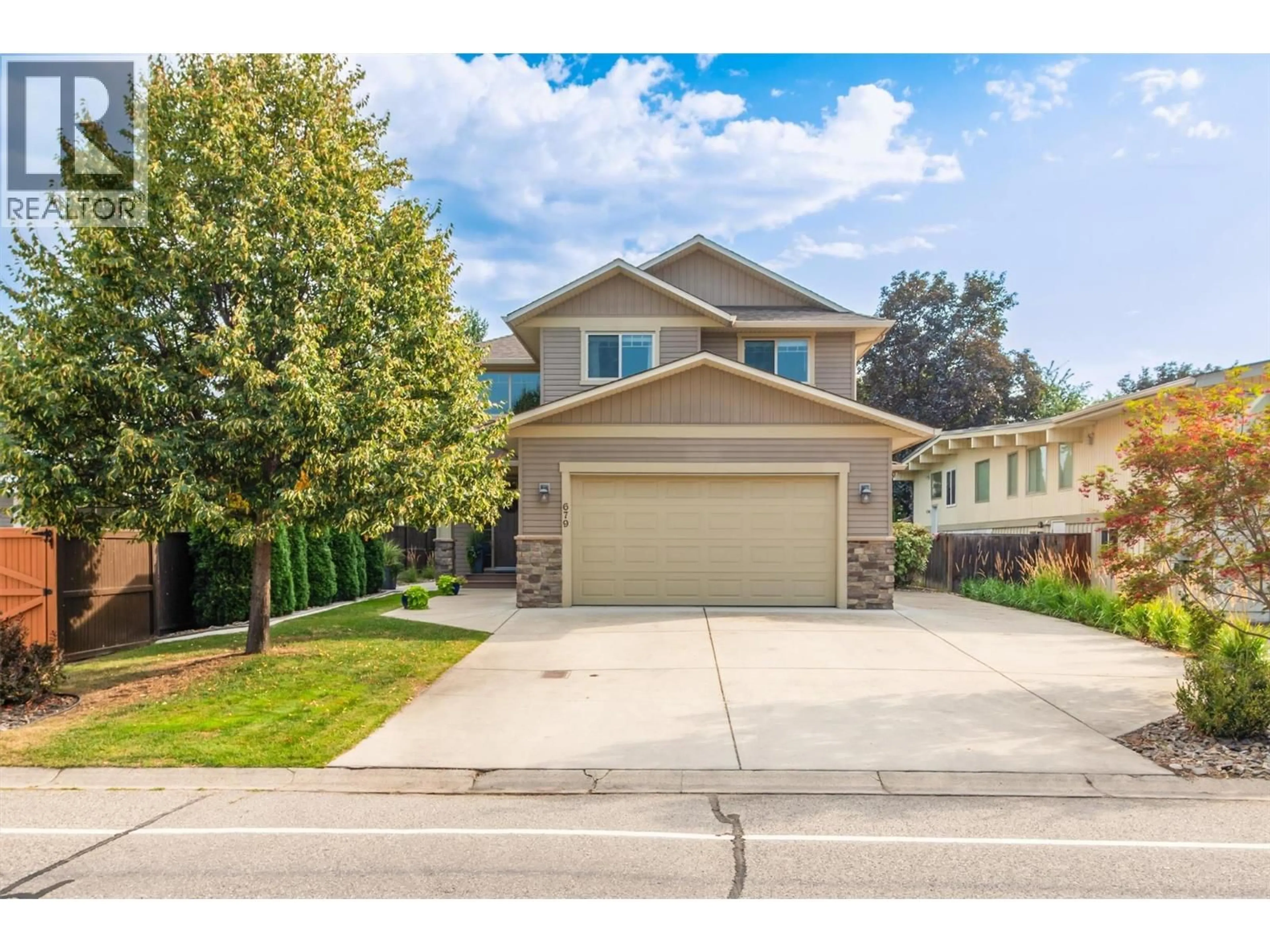 Home with vinyl exterior material, street for 679 OLD MEADOWS ROAD, Kelowna British Columbia V1W1S3