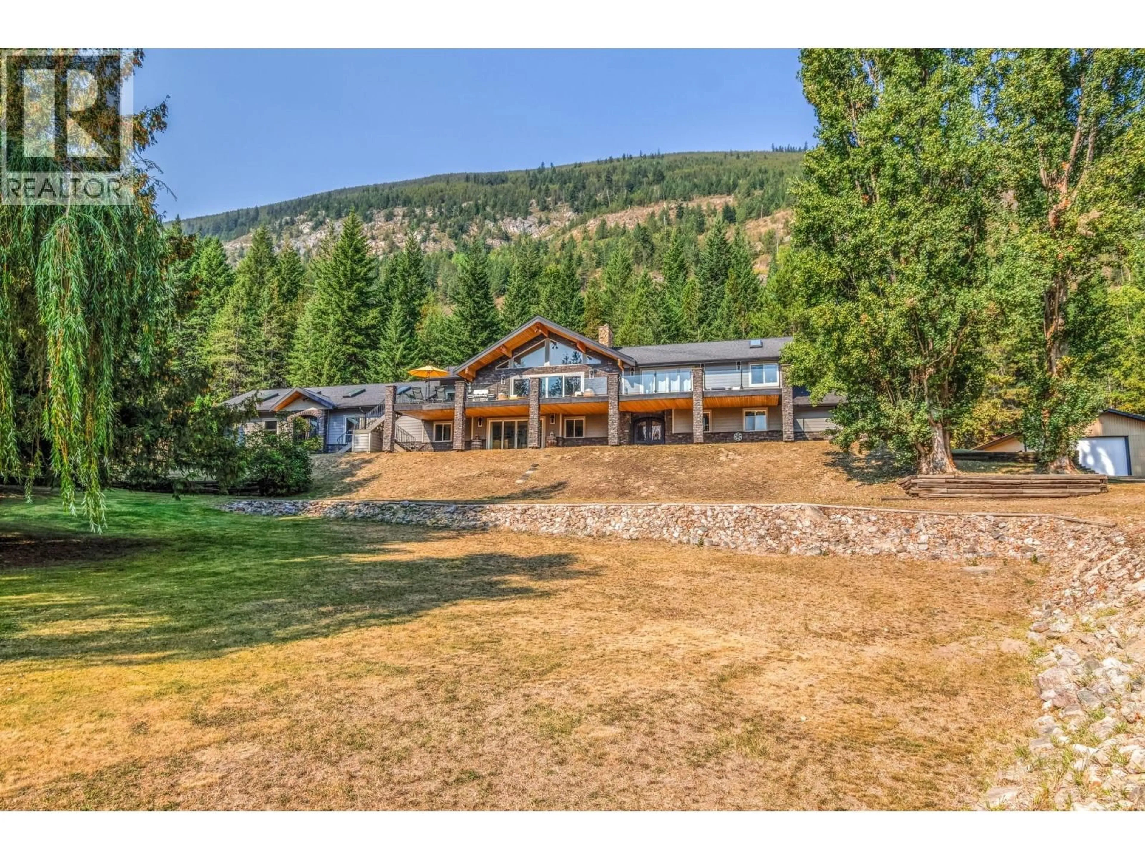A pic from outside/outdoor area/front of a property/back of a property/a pic from drone, mountain view for 6171 50 STREET NORTHWEST, Salmon Arm British Columbia V1E3A6