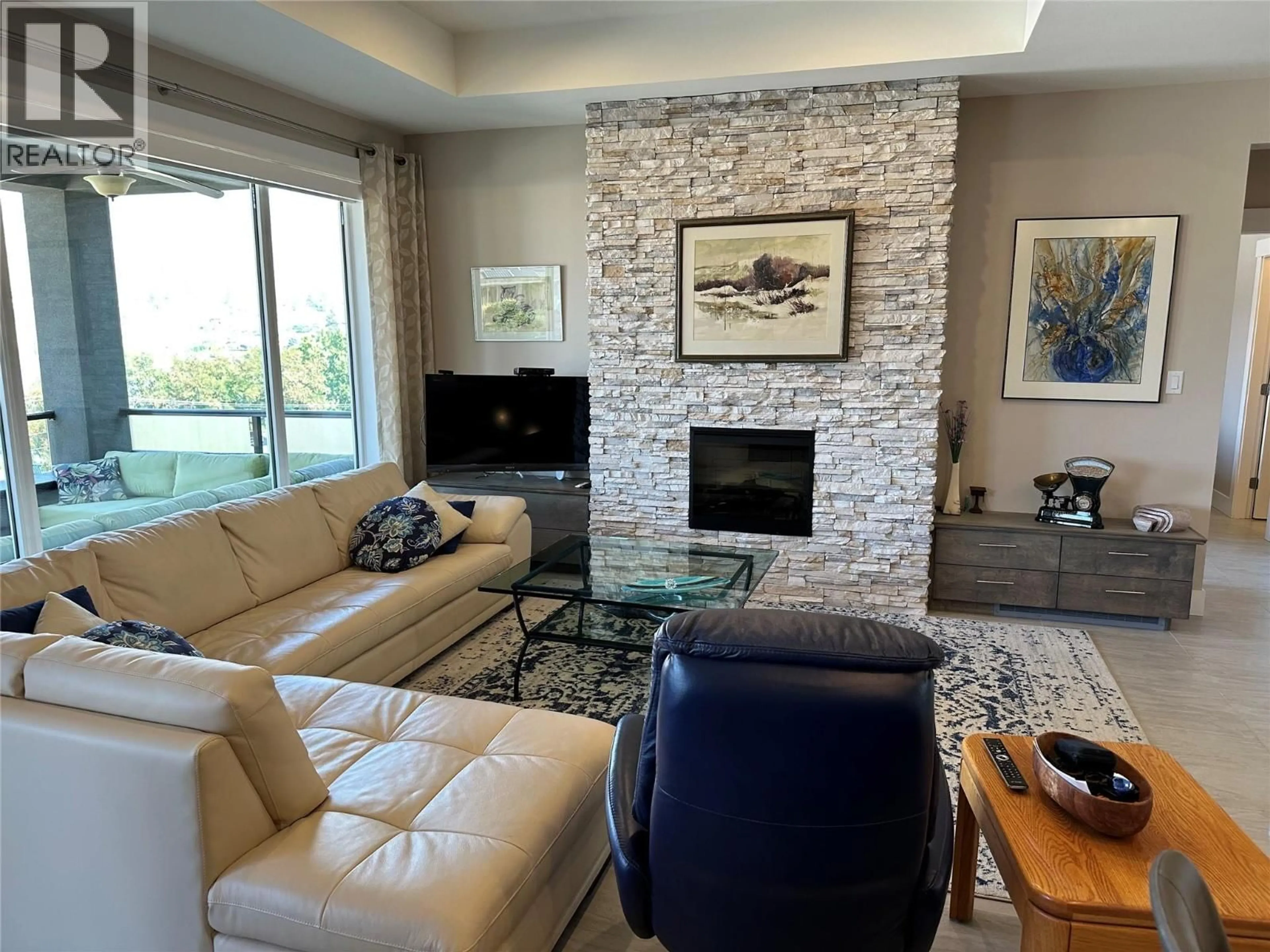 Living room with furniture, ceramic/tile floor for 440 MERLOT AVENUE, Oliver British Columbia V0H1T4