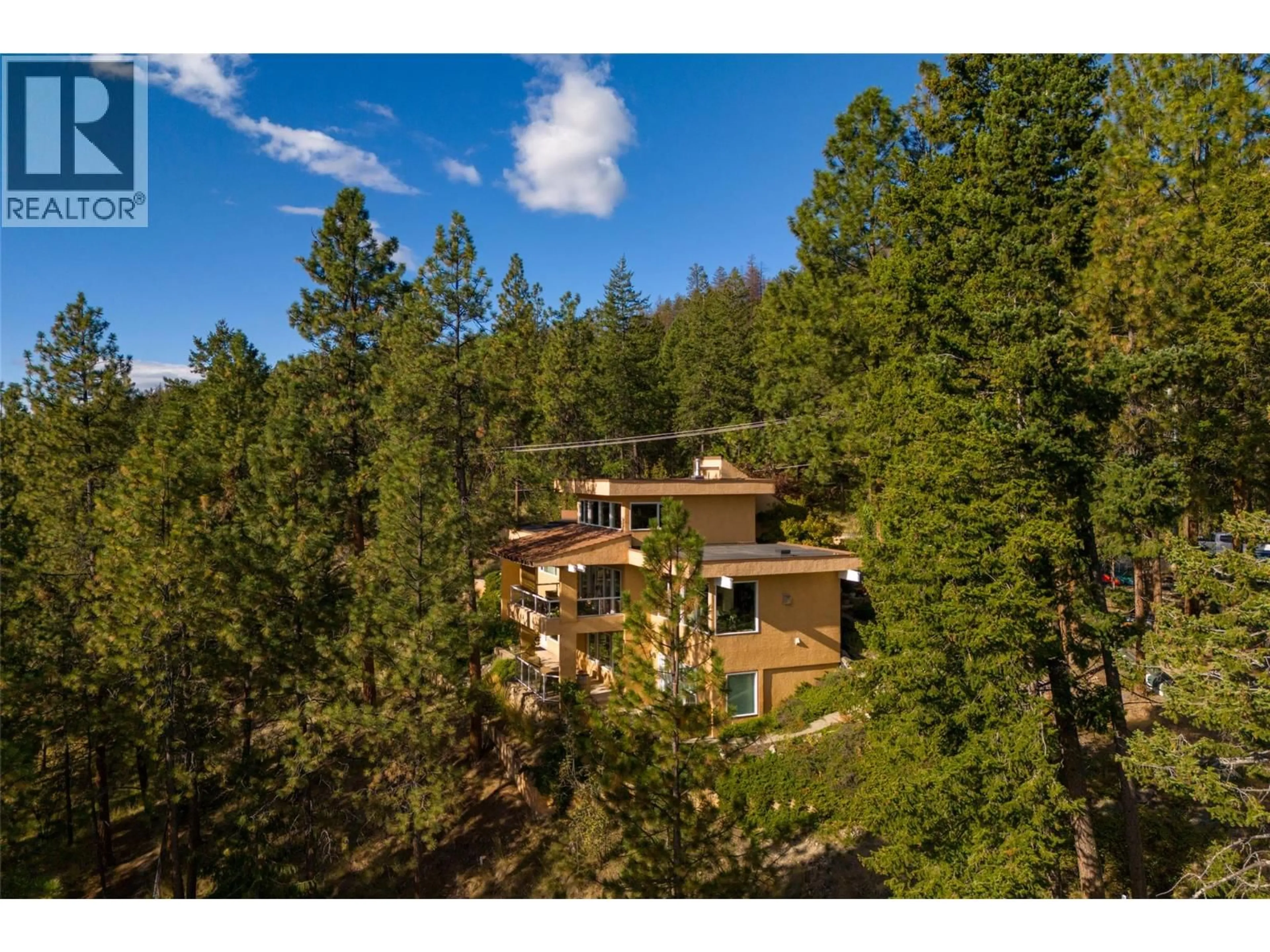 A pic from outside/outdoor area/front of a property/back of a property/a pic from drone, forest/trees view for 1642 WEST KELOWNA ROAD, West Kelowna British Columbia V1Z3B7