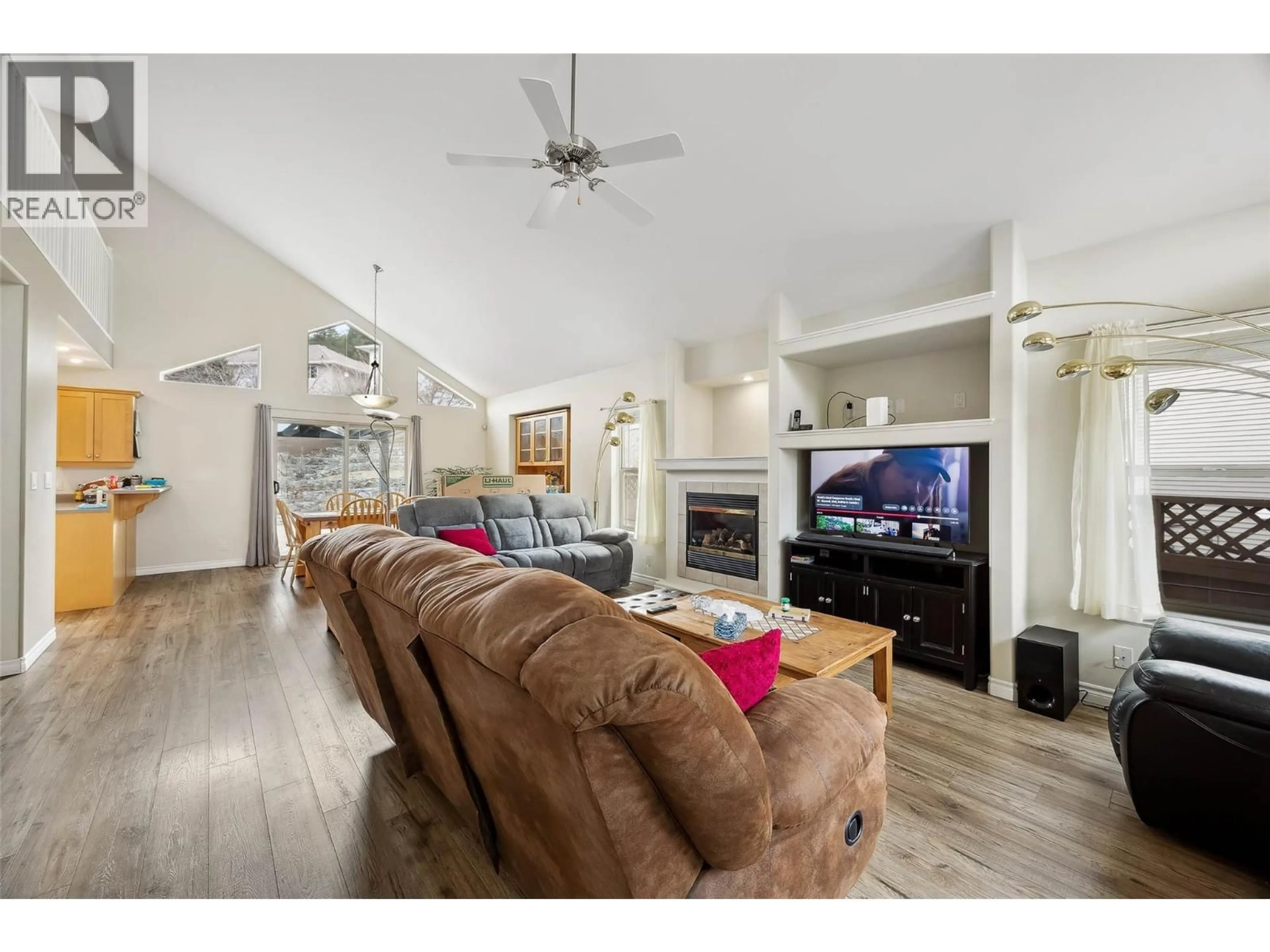 Living room with furniture, wood/laminate floor for 1925 ENGLEMANN COURT, Kamloops British Columbia V1S1X9