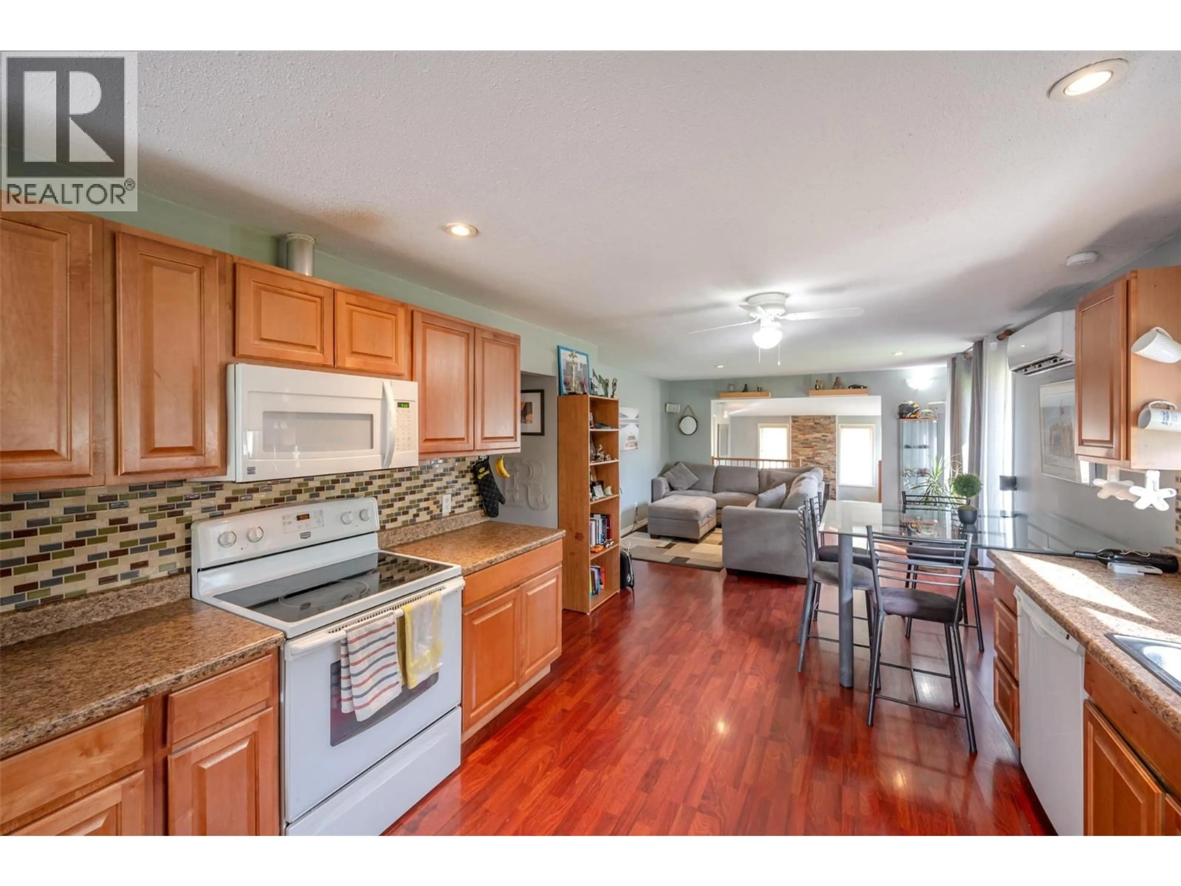 Open concept kitchen, wood/laminate floor for 5471 SAWMILL ROAD, Oliver British Columbia V0H1T1