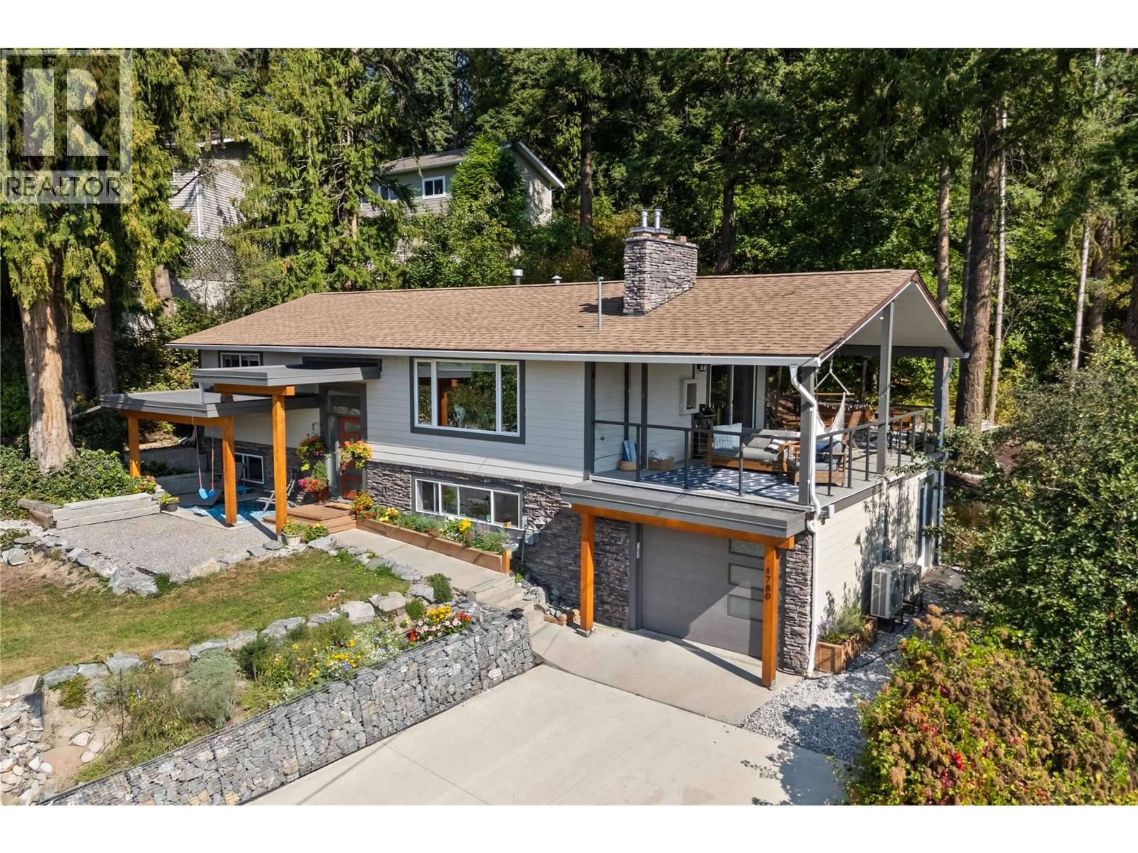 A pic from outside/outdoor area/front of a property/back of a property/a pic from drone, street for 1780 16 STREET NORTHEAST, Salmon Arm British Columbia V1E3Z8