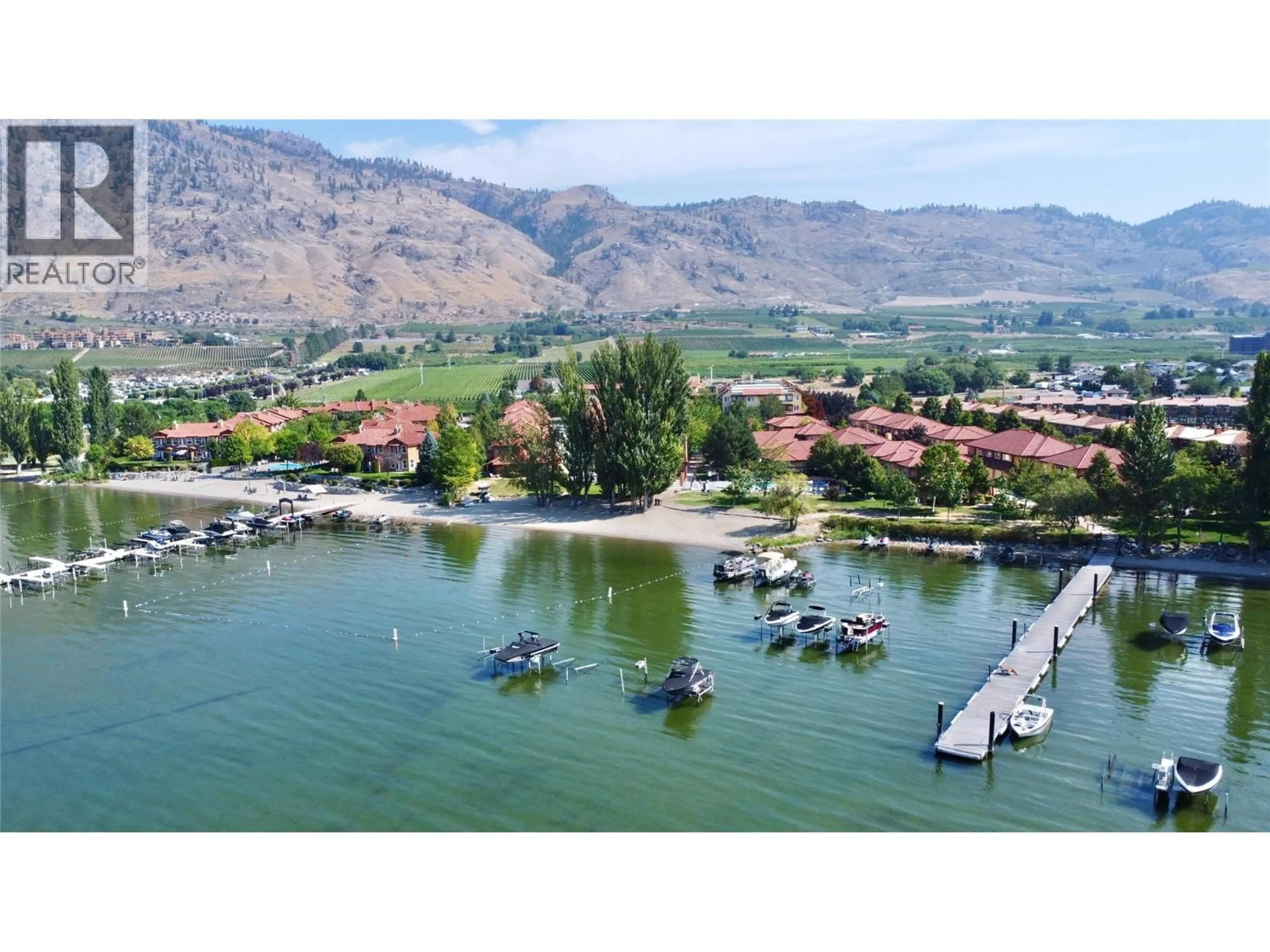 A pic from outside/outdoor area/front of a property/back of a property/a pic from drone, water/lake/river/ocean view for 406 - 7600 COTTONWOOD DRIVE, Osoyoos British Columbia V0H1V3
