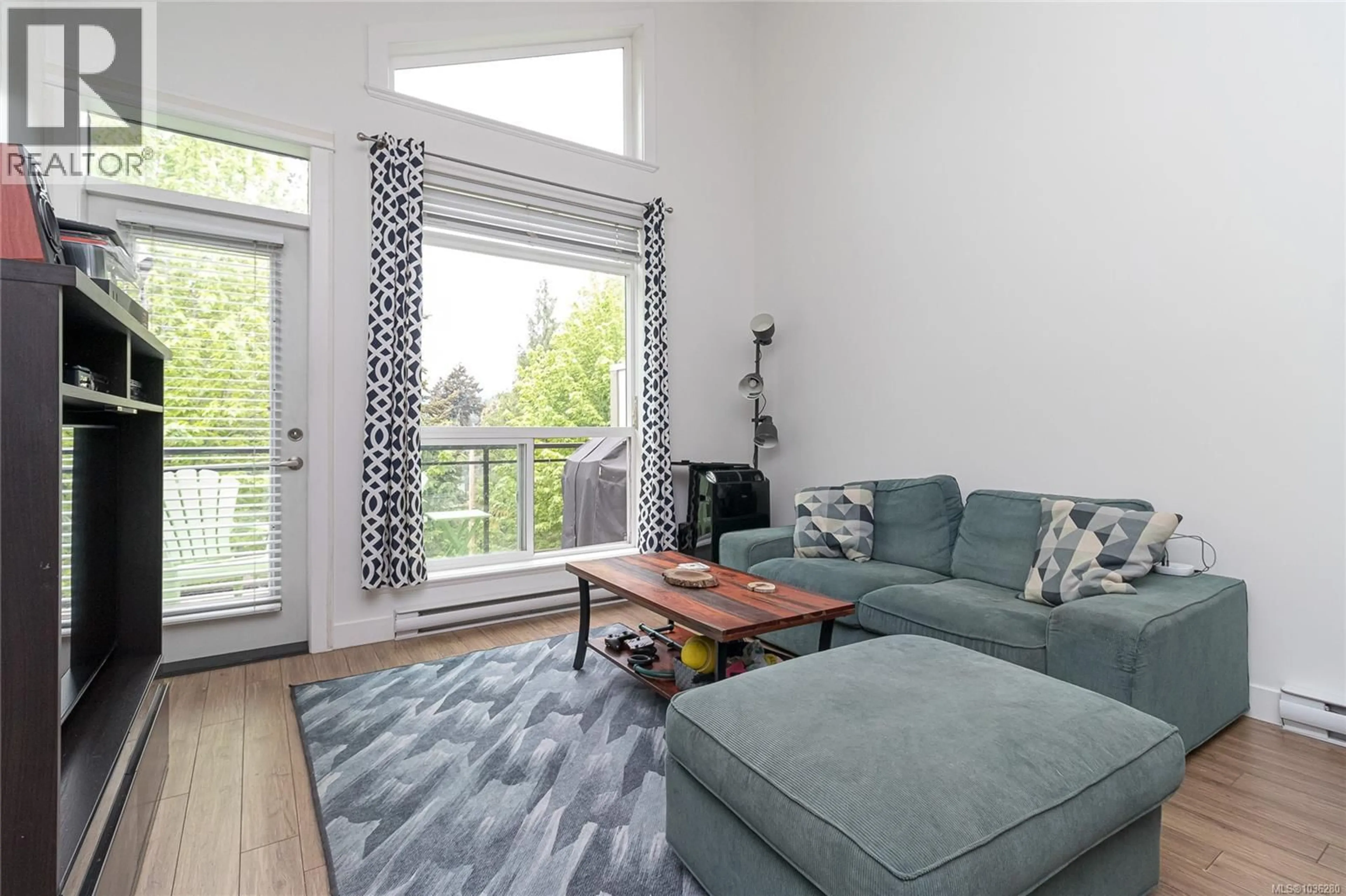 Living room with furniture, wood/laminate floor for 309 - 938 DUNFORD AVENUE, Langford British Columbia V9B2S3