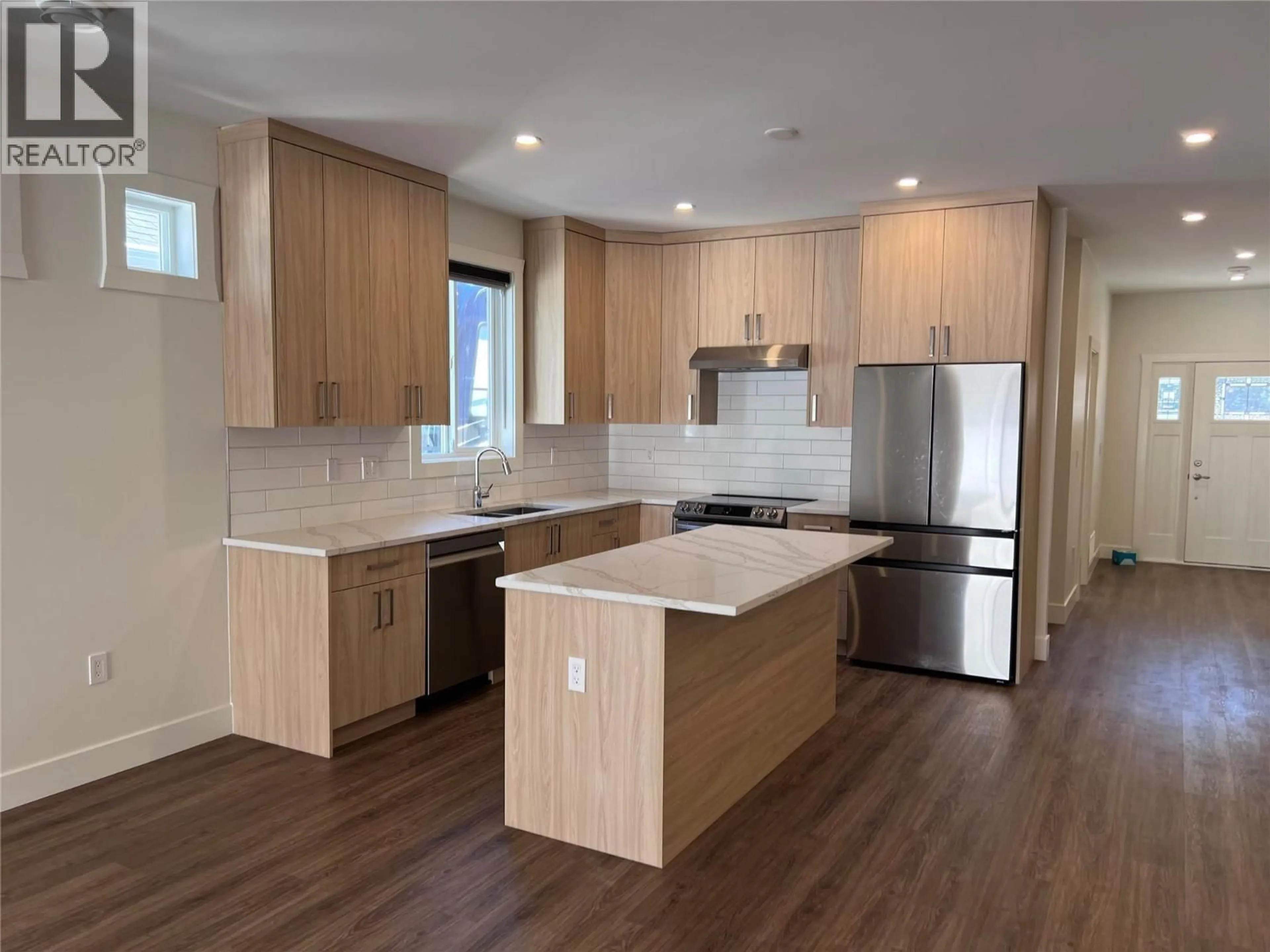 Open concept kitchen, wood/laminate floor for 288 BENTGRASS AVENUE, Oliver British Columbia V0H1T3