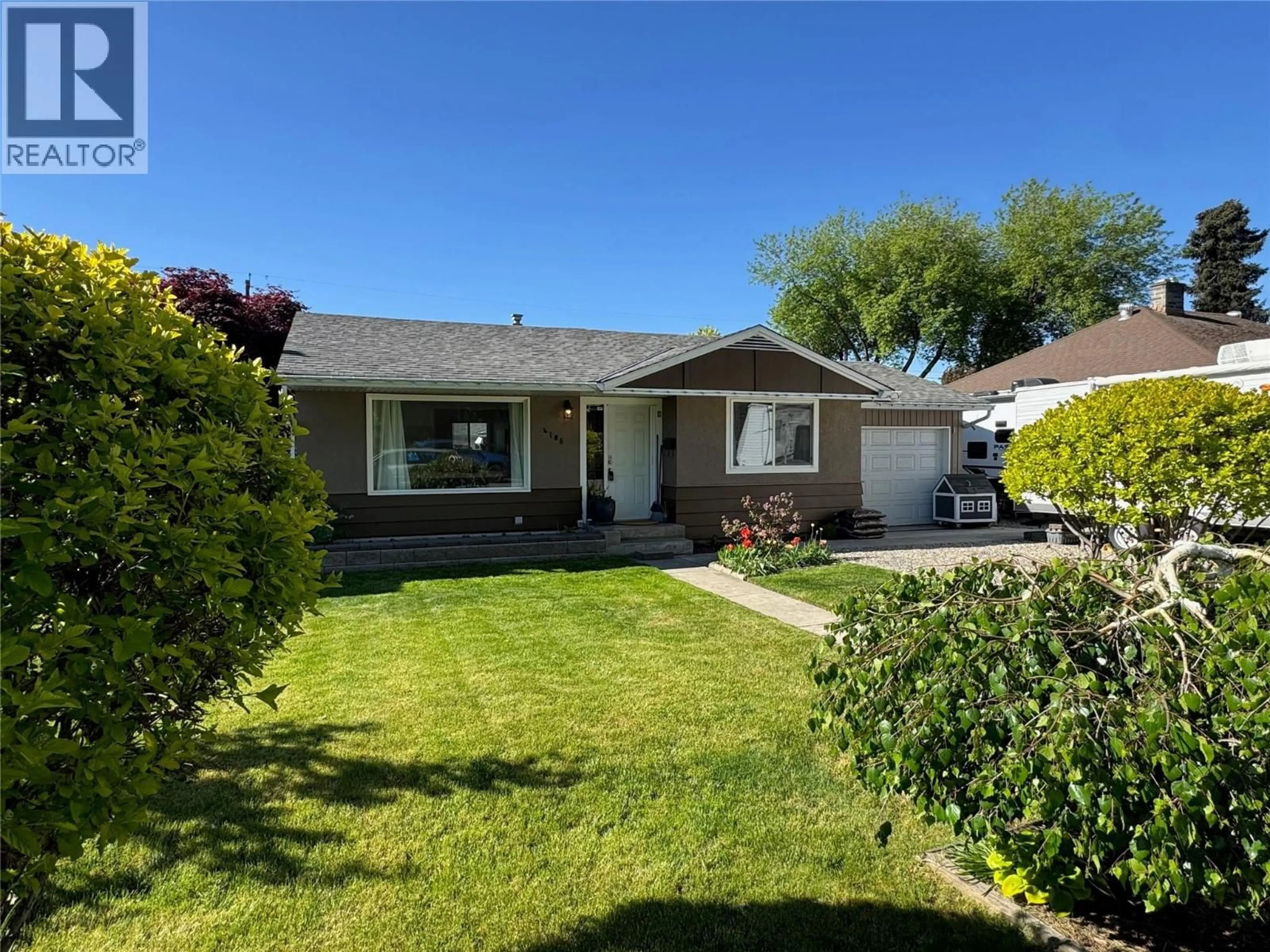 A pic from outside/outdoor area/front of a property/back of a property/a pic from drone, street for 4106 28 AVENUE, Vernon British Columbia V1T1X5