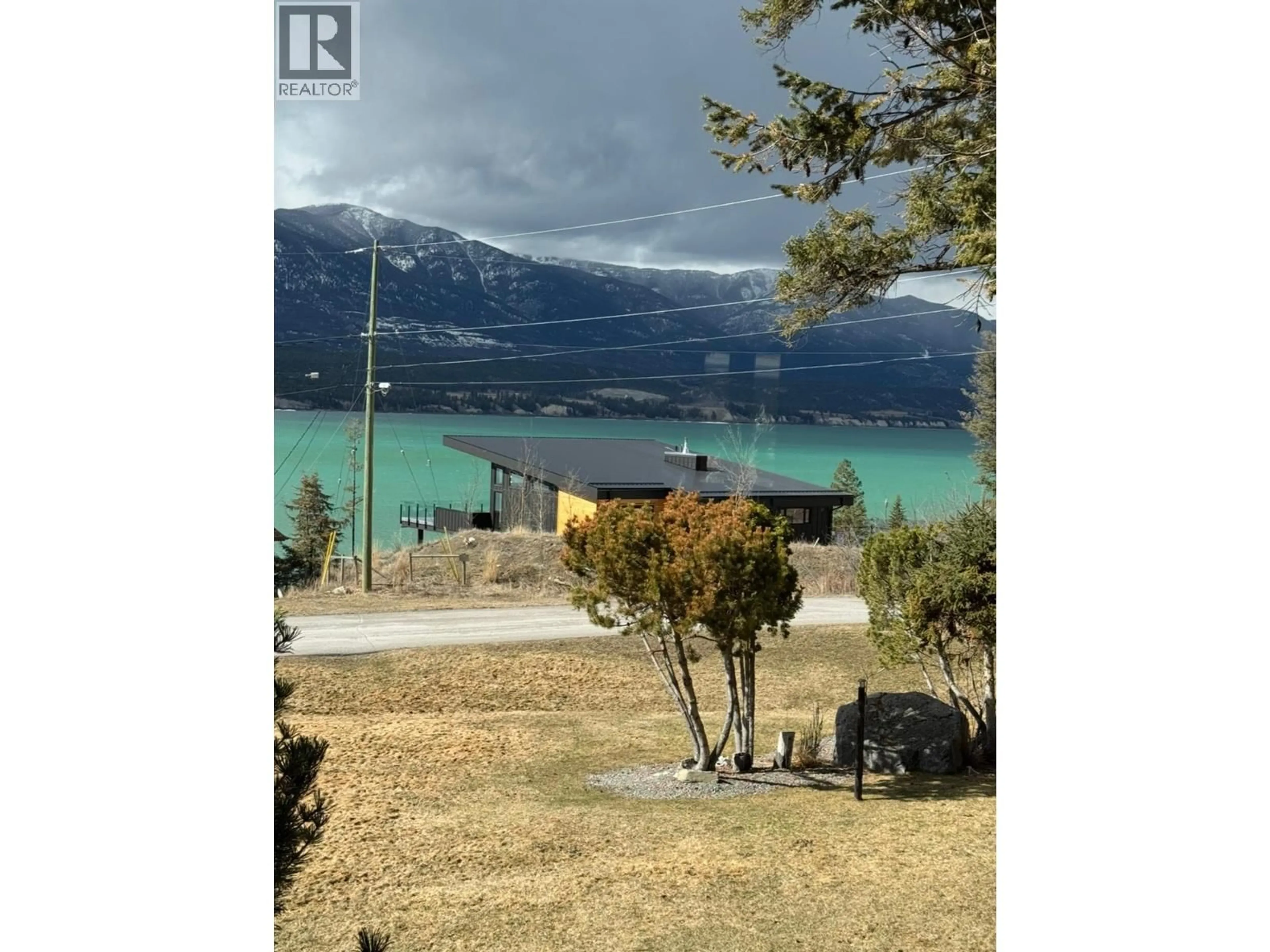 A pic from outside/outdoor area/front of a property/back of a property/a pic from drone, water/lake/river/ocean view for 8380 RICHARDSON CRESCENT, Canal Flats British Columbia V0B1B0