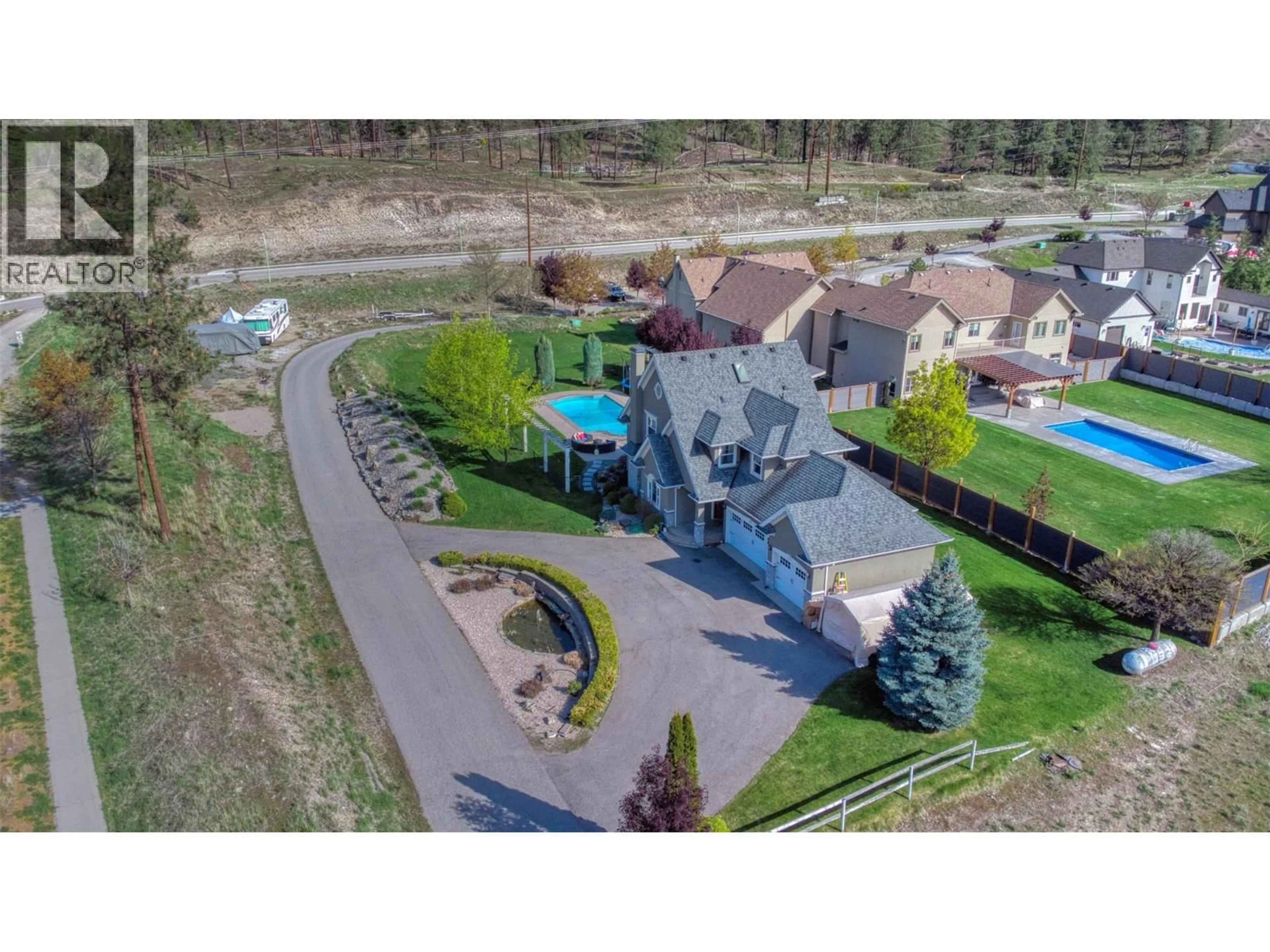 A pic from outside/outdoor area/front of a property/back of a property/a pic from drone, water/lake/river/ocean view for 5308 UPPER MISSION DRIVE, Kelowna British Columbia V1W3S9