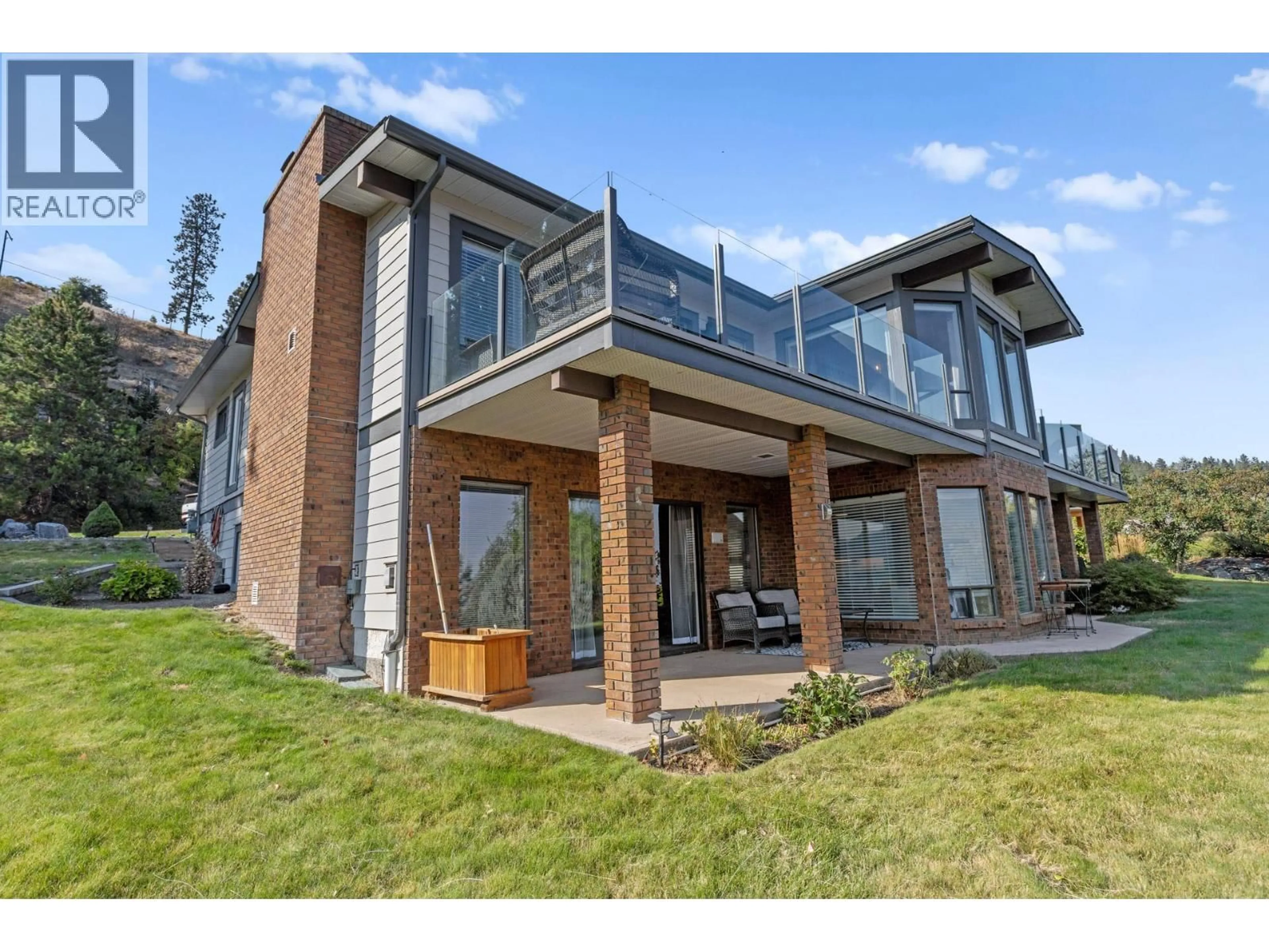 Home with brick exterior material, unknown for 6555 SHERBURN ROAD, Peachland British Columbia V0H1X7