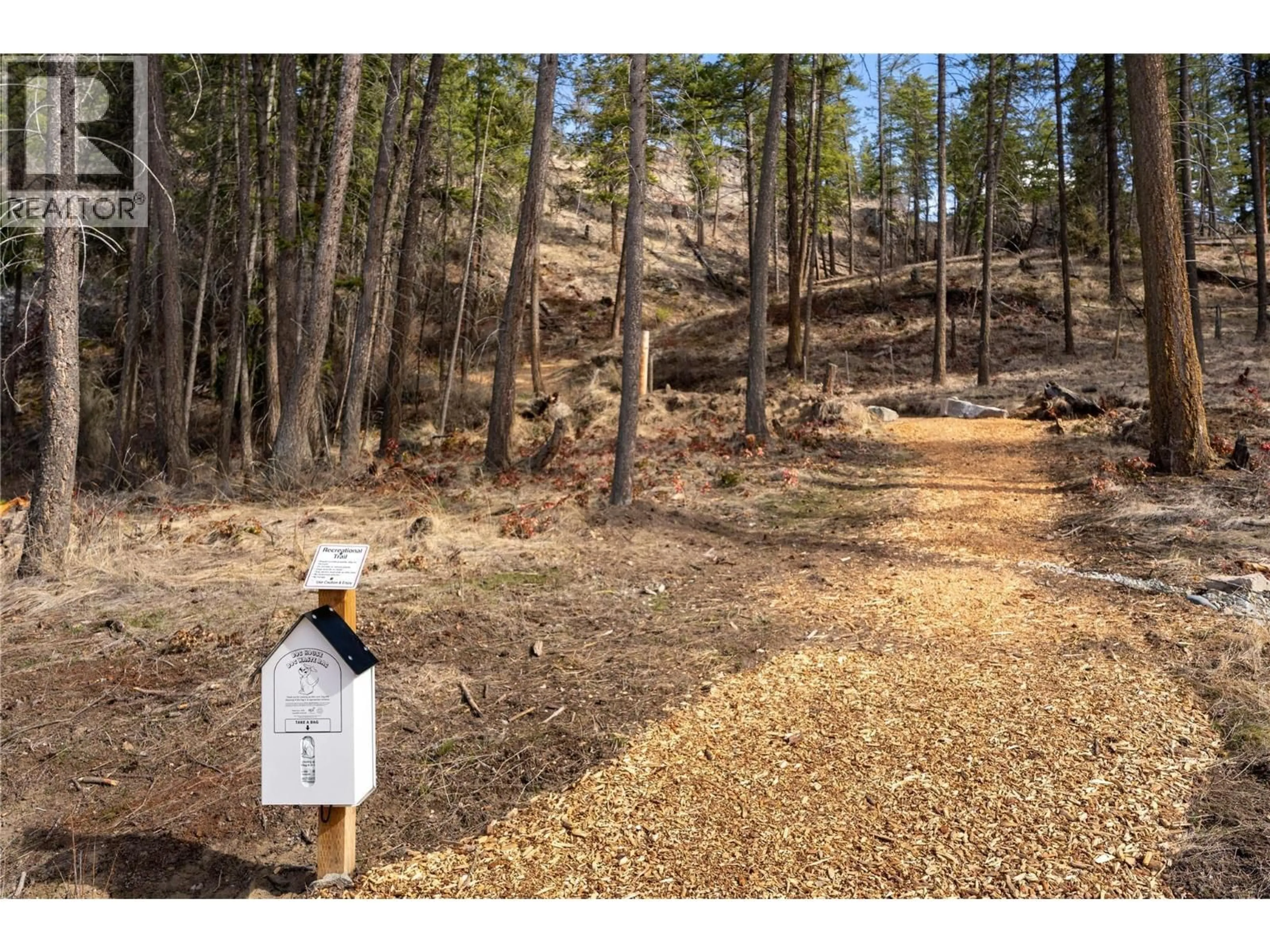 A pic from outside/outdoor area/front of a property/back of a property/a pic from drone, forest/trees view for 9 - 1960 NORTHERN FLICKER COURT, Kelowna British Columbia V1V0G3