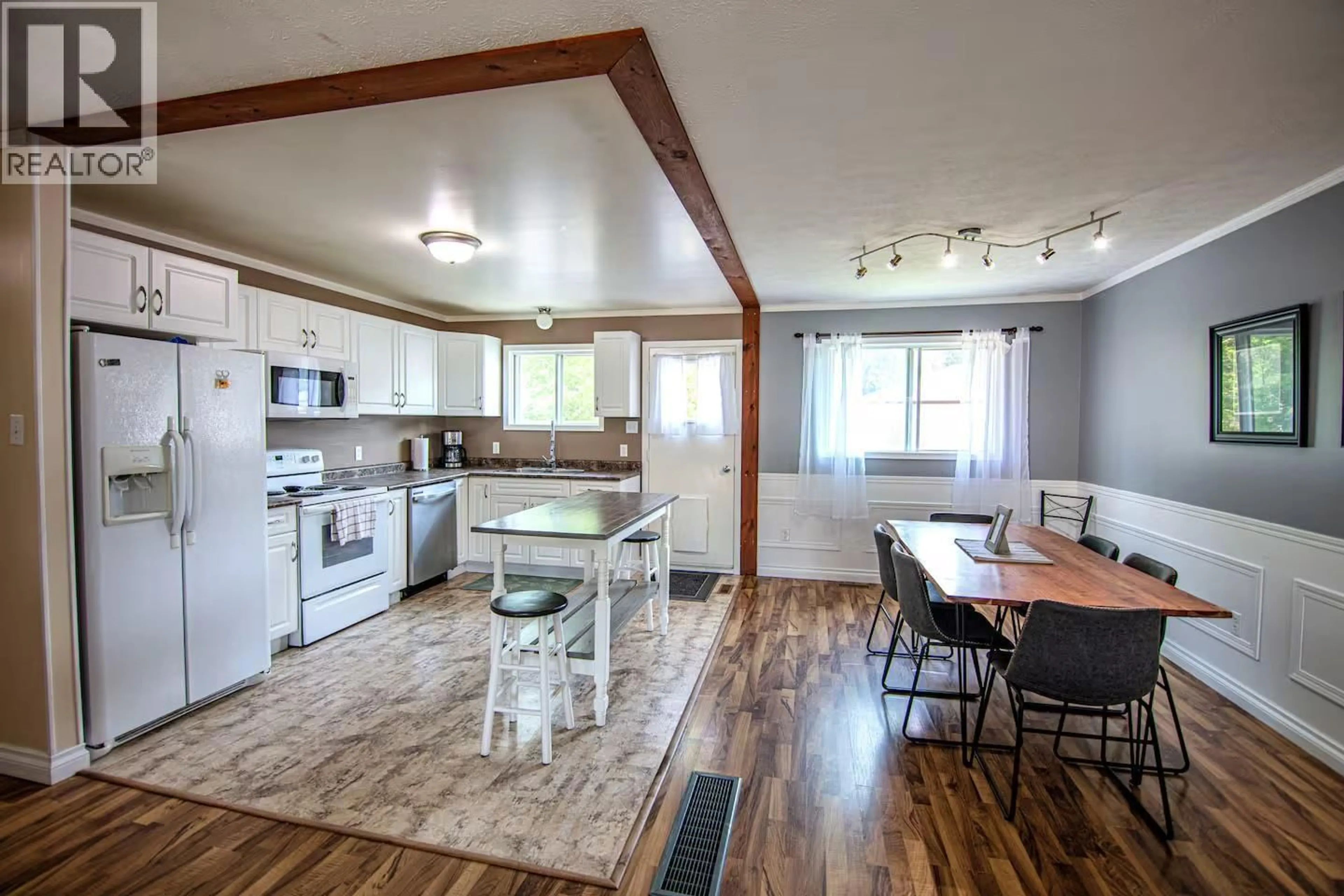 Open concept kitchen, wood/laminate floor for 116 WOLVERINE AVENUE, Tumbler Ridge British Columbia V0C2W0