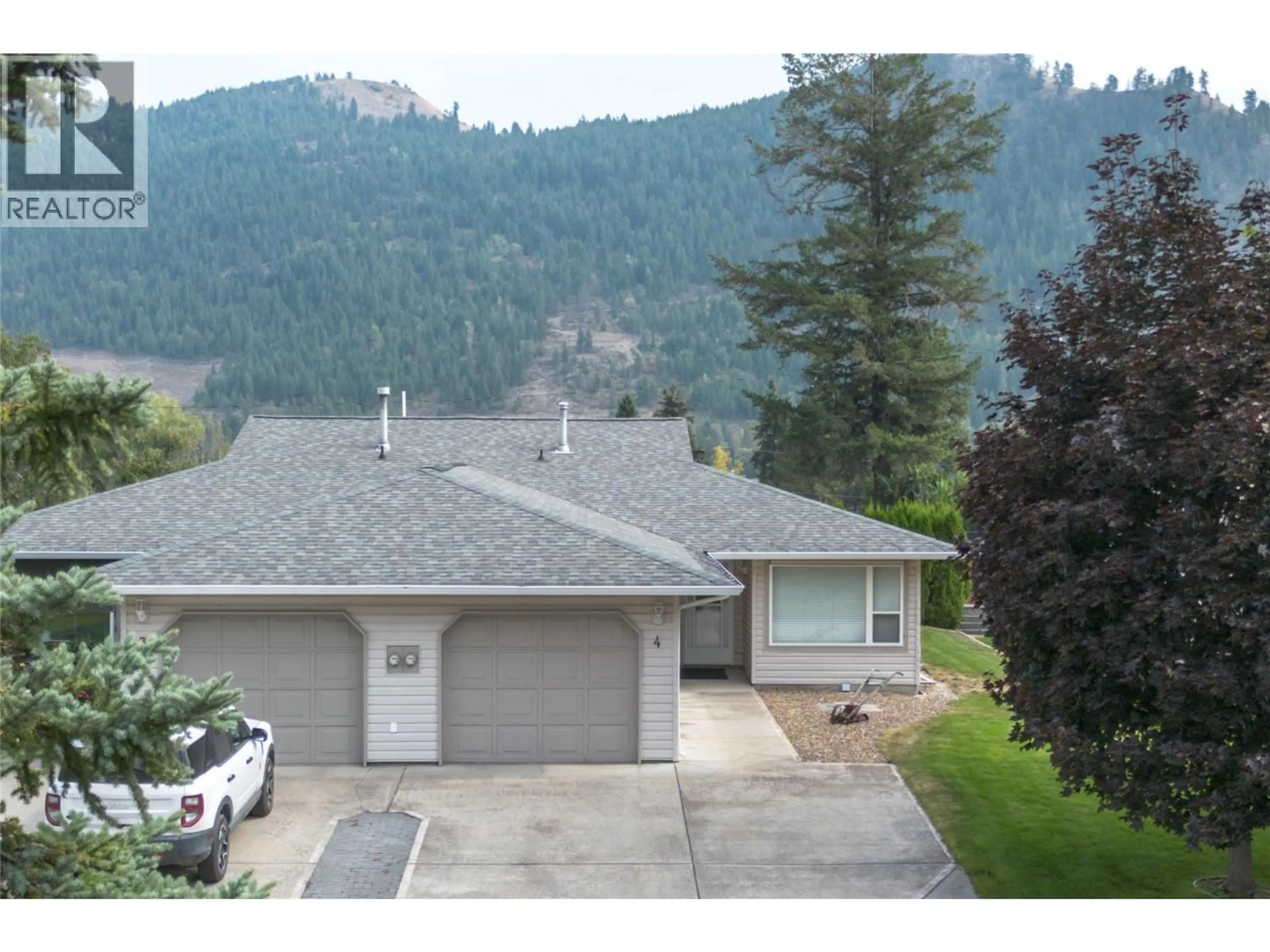 A pic from outside/outdoor area/front of a property/back of a property/a pic from drone, mountain view for 4 - 2675 PINE AVENUE, Lumby British Columbia V0E2G5