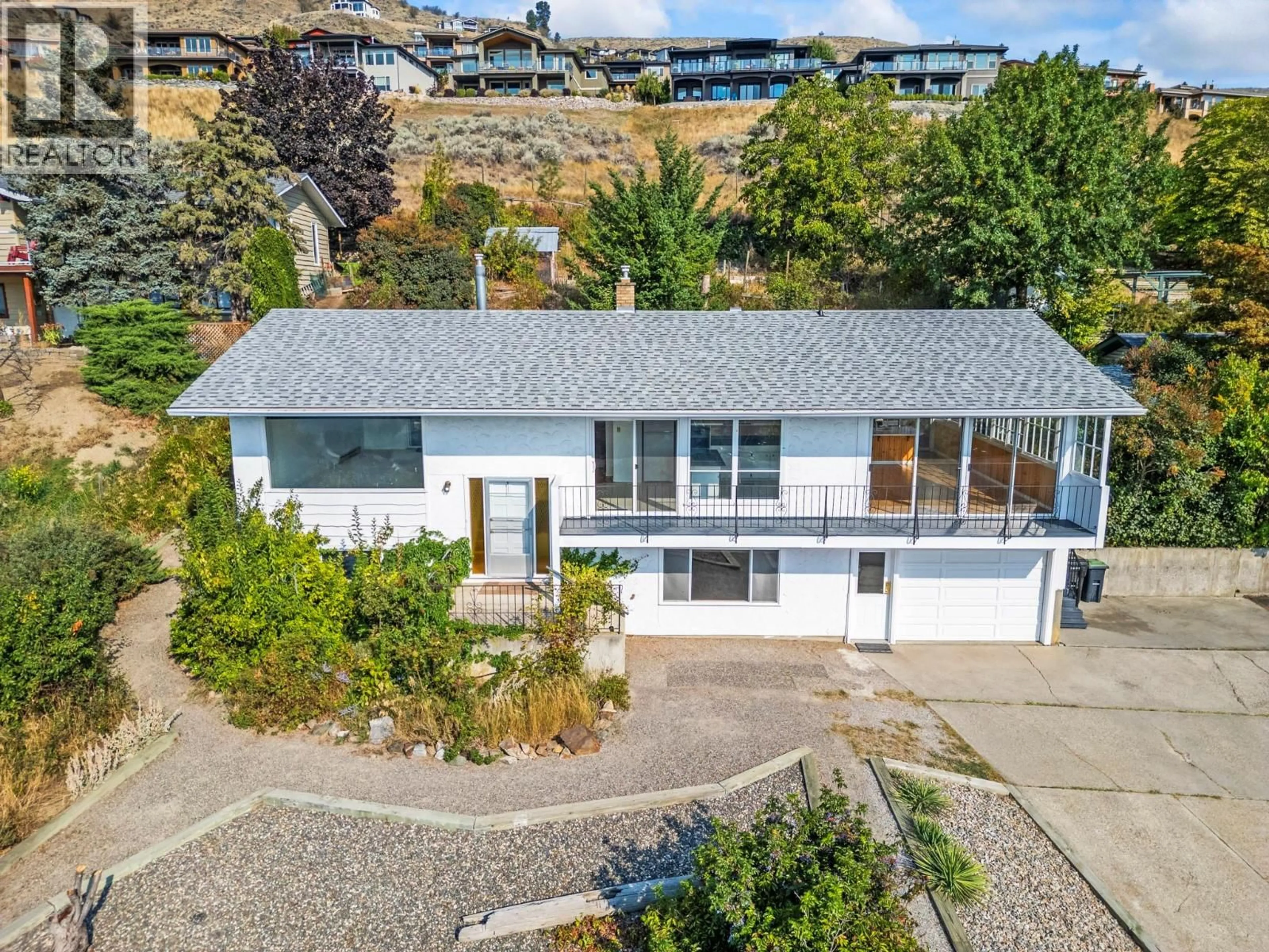 A pic from outside/outdoor area/front of a property/back of a property/a pic from drone, unknown for 7061 APPALOOSA WAY, Vernon British Columbia V1H1B9