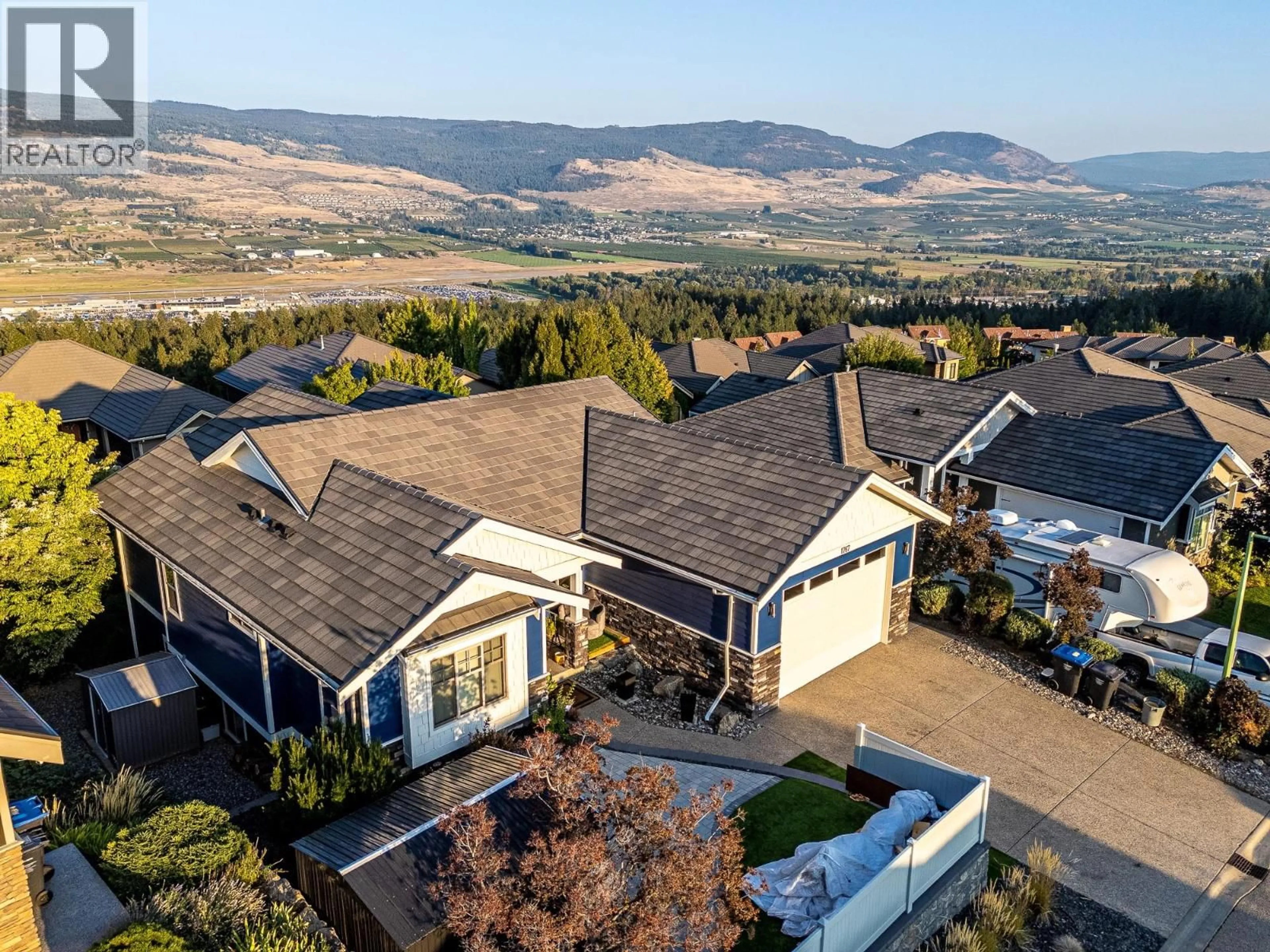 A pic from outside/outdoor area/front of a property/back of a property/a pic from drone, mountain view for 1767 CAPISTRANO PEAKS CRESCENT, Kelowna British Columbia V1V2N1