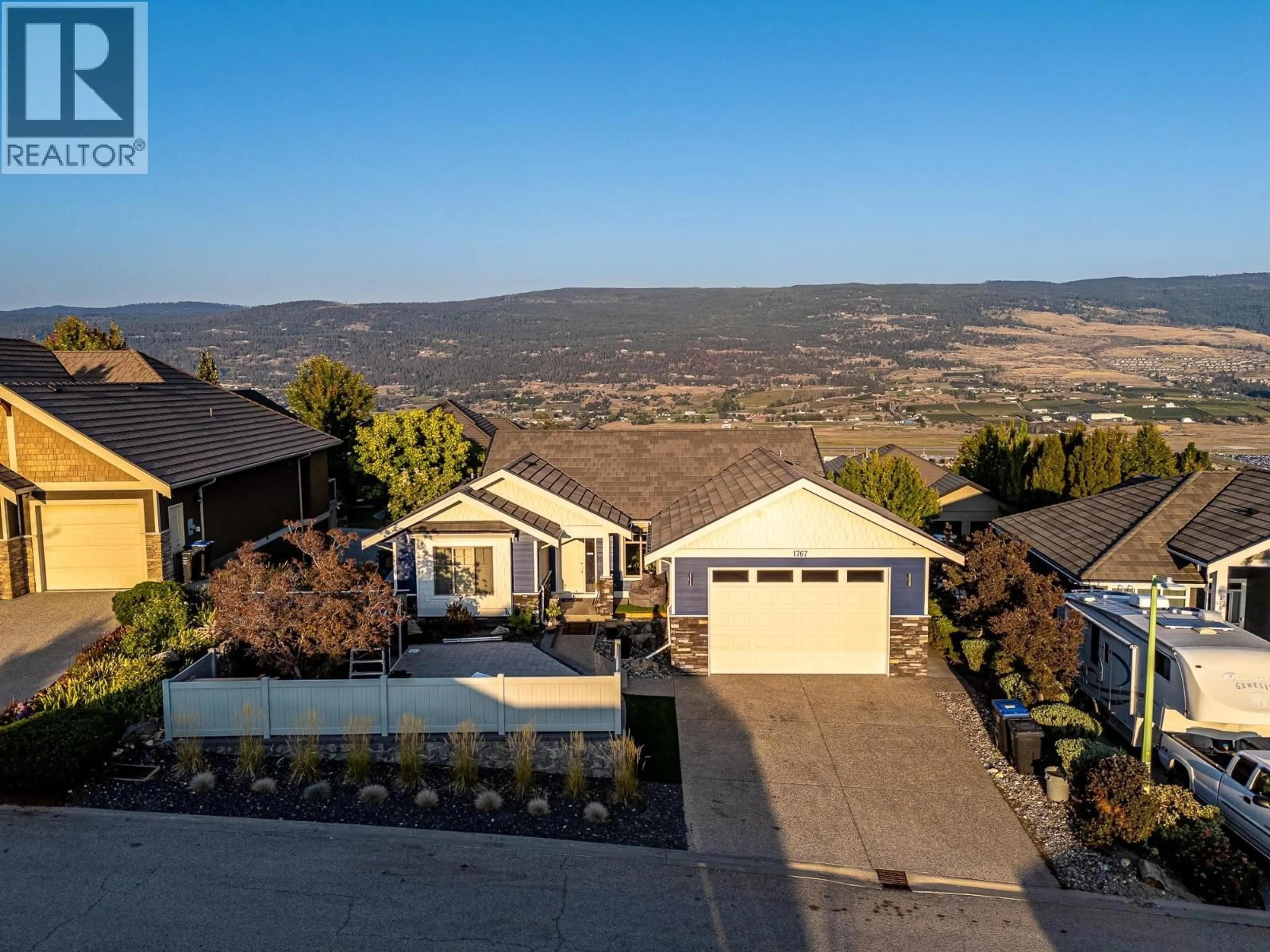 A pic from outside/outdoor area/front of a property/back of a property/a pic from drone, mountain view for 1767 CAPISTRANO PEAKS CRESCENT, Kelowna British Columbia V1V2N1